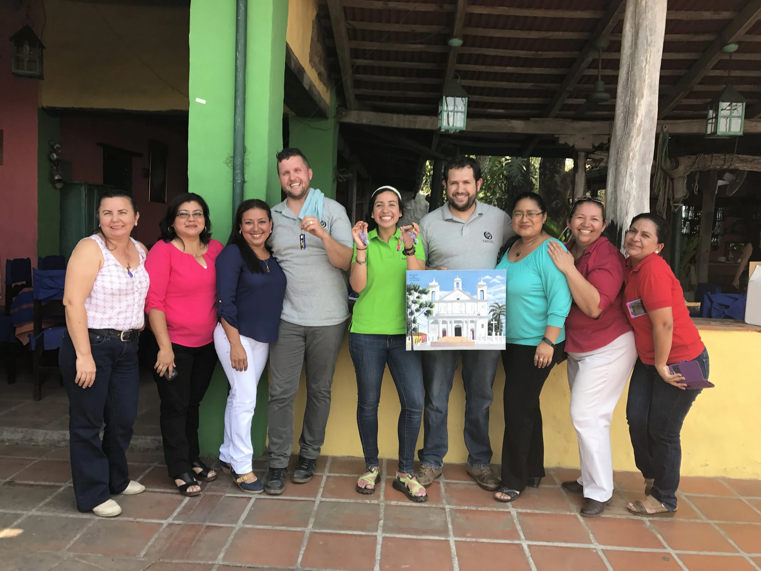 Matthew Parker, Lavinia Fernandez and Marco Arroyo (3 middle) amidst a team of grateful teachers, showing off their gifts of gratitude--tokens the whole team treasures on the other side of their hard work. 