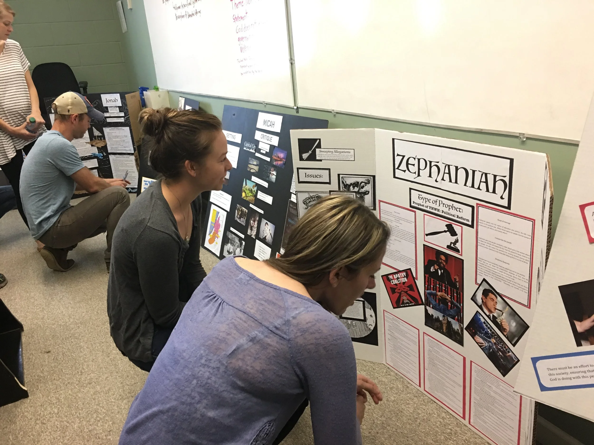 Students from Prophets class observe one another's visual displays during the final day of class. 