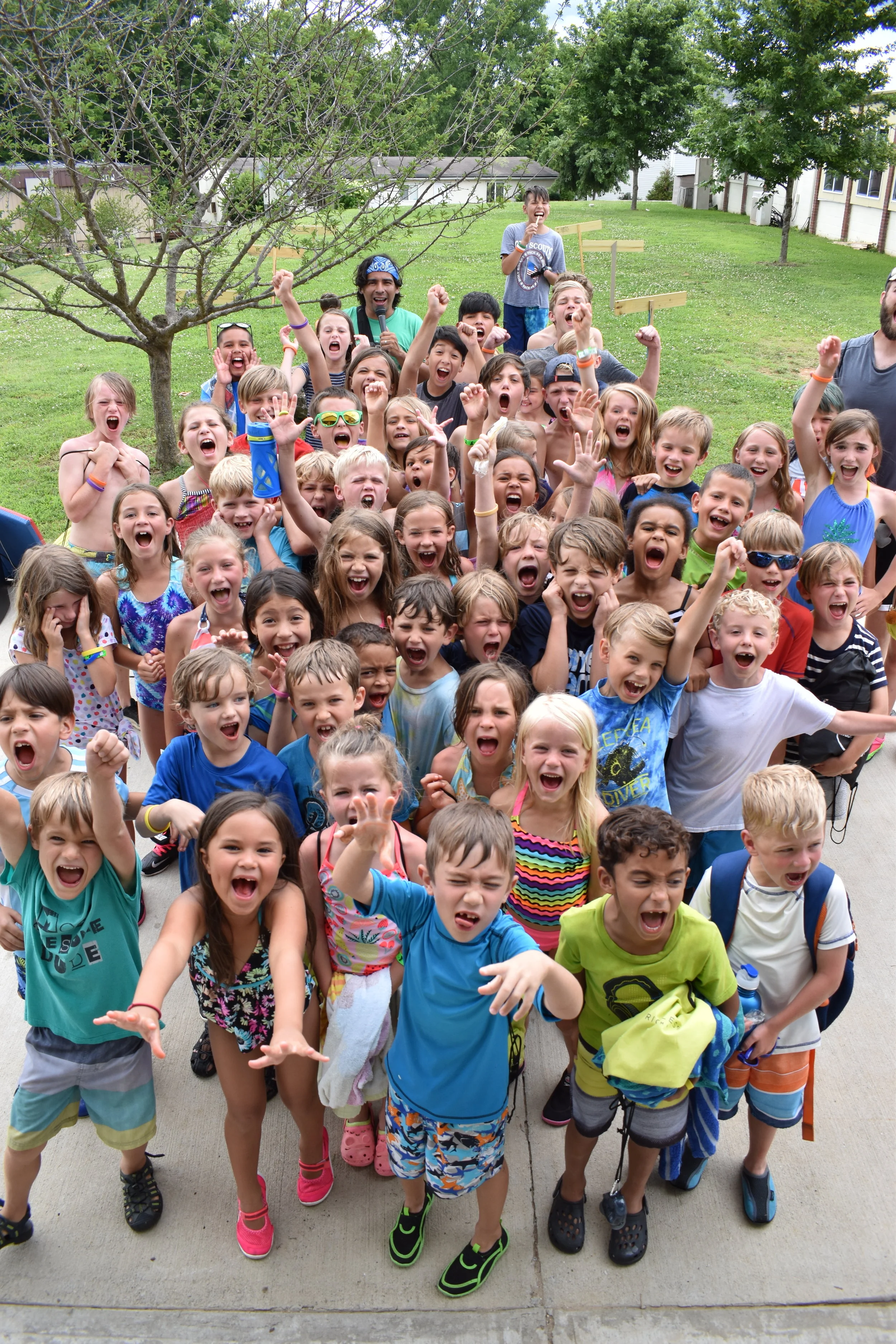Robert Munoz, in the back, is the cheerleader these campers need as they work through competitions and team activities during the week. 