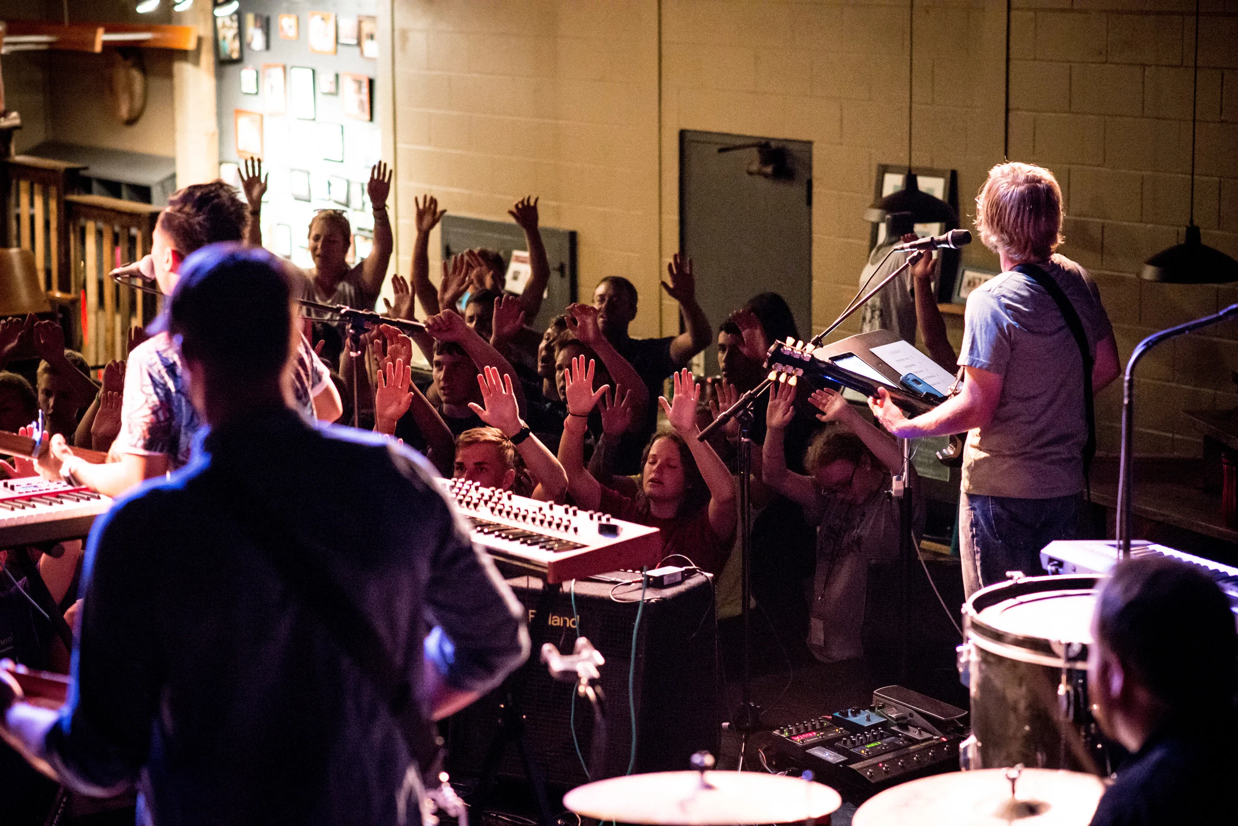 Leading SLAM groups is not for the weak of flesh. On both sides of this photo you see not just the students in worship--but SLAM staff, teachers, small group facilitators, all worshipping God with everything. This same group of worshipers work a full-time job and facilitate moments like this for young people after hours. 