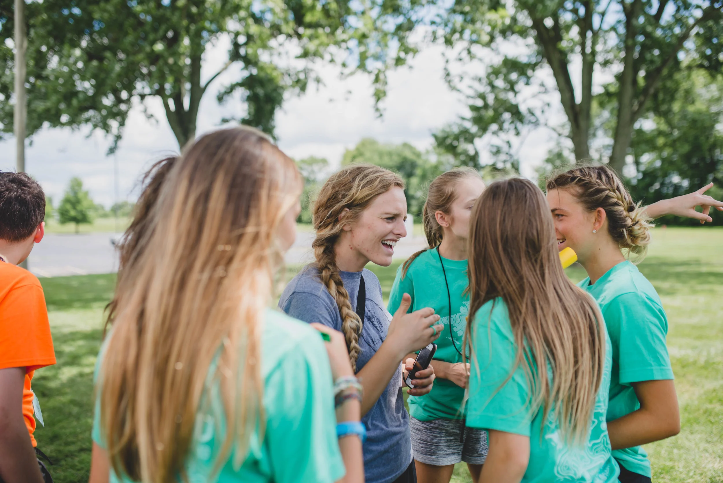 Institute student Chelsie Waldron encourages SLAM students right before they begin the relay race they'd planned for kids at SON ministries. While Chelsie has had a lot of experience organizing games through CampSkillz and SLAM, she challenged the students to take charge by creating their own unique relay and heading it up themselves.