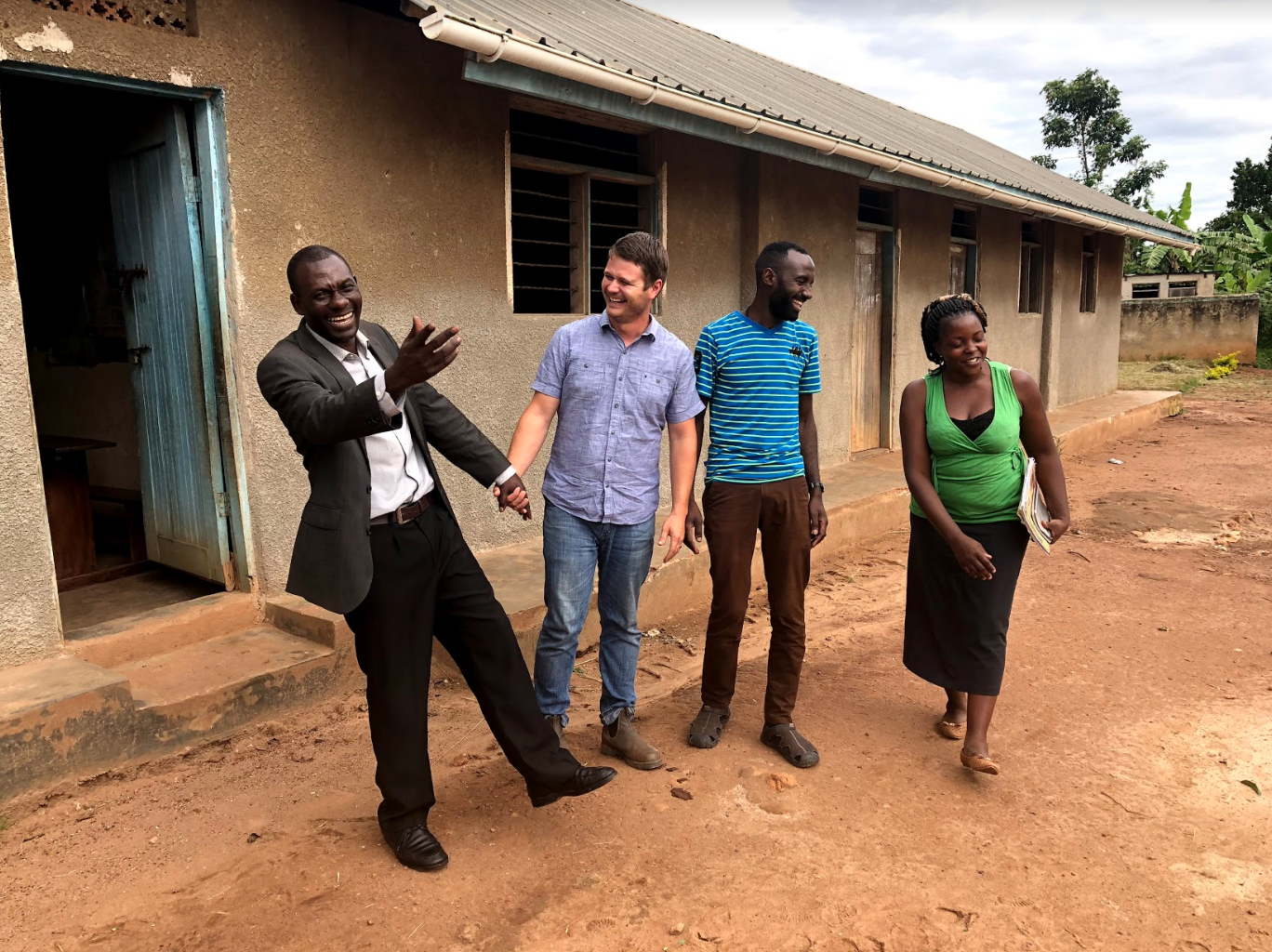 John continues to be involved in helping schools. Here, he meets with the headmaster at St. John’s, G.O.D.’s partner school in Uganda, alongside Cameron Kagay, G.O.D. East Africa lead manager, and Josephine Nakimuli, a teacher at the school.