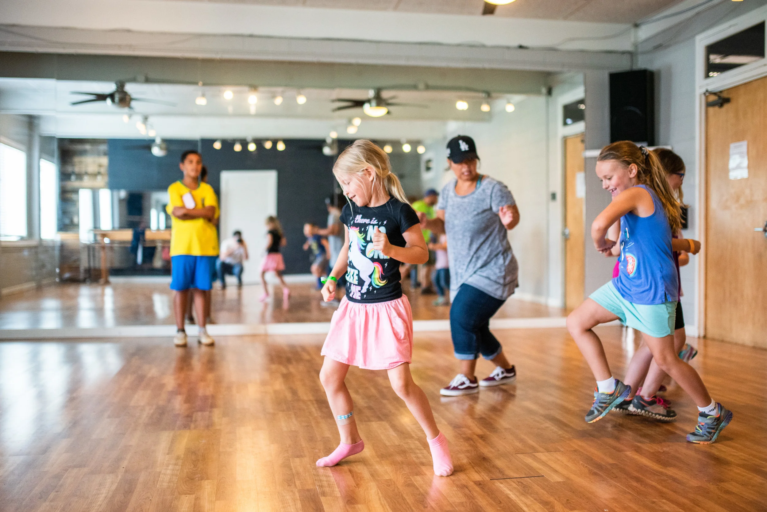 Trinity Garner leads a hip hop dance workshop with campers. Movement of the body in connection with your soul is a healthy practice for everyone.
