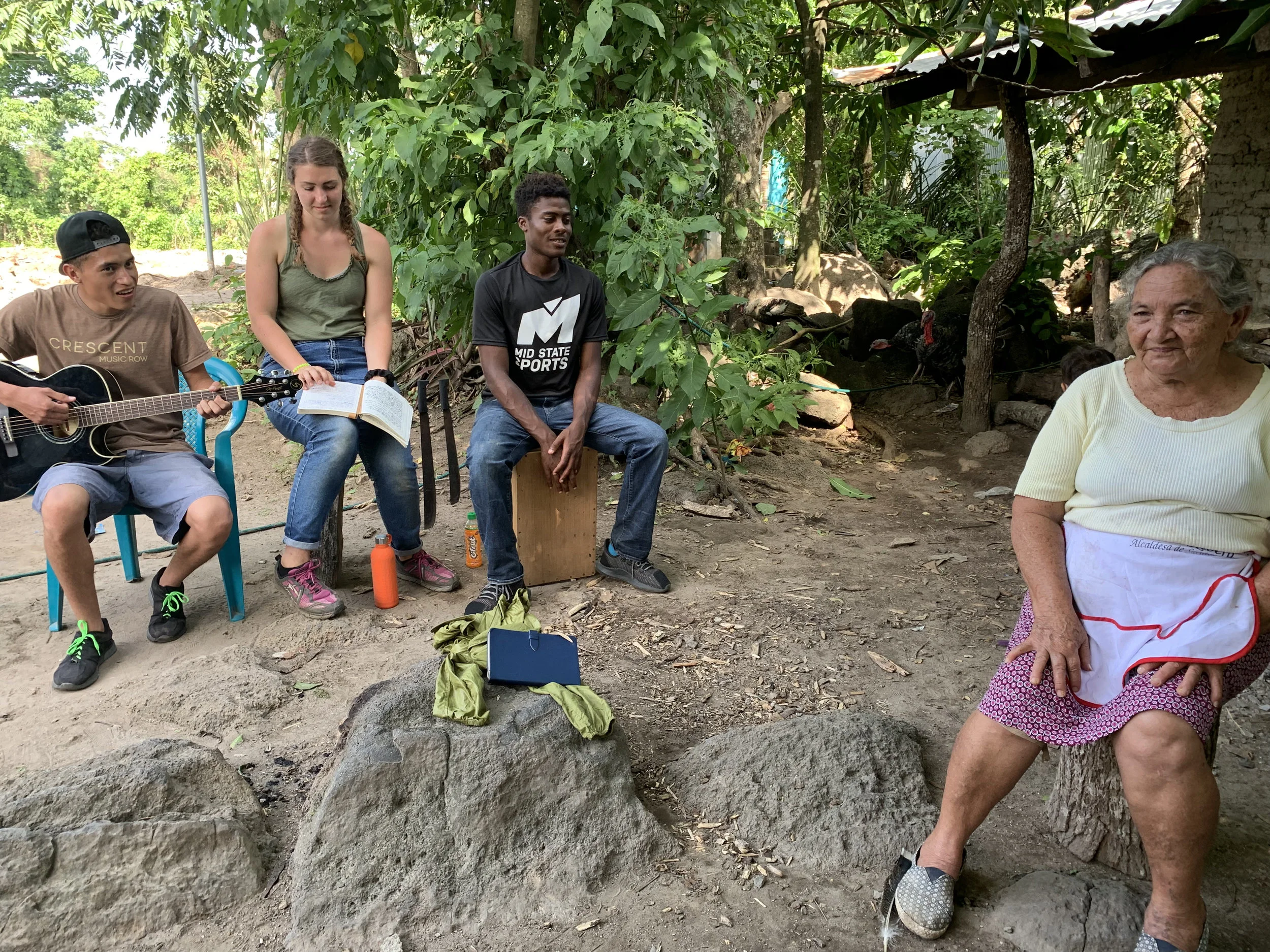 Alison and Gerron, members of Da Mission team, singing worship songs with Antonia at right.