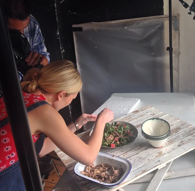 Lucy 'natural-ising' while Kris sets up the Jerk Pulled Pork and Salted Watermelon Salad shot