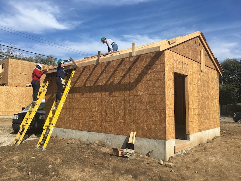  Installing blocking on the garage of the Women Build house. 