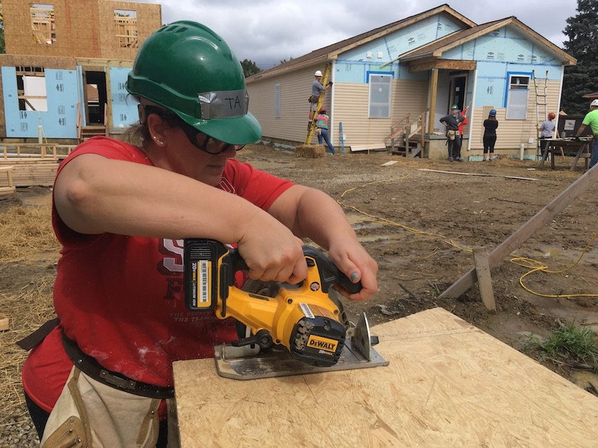  A volunteer’s first time using a power tool. 