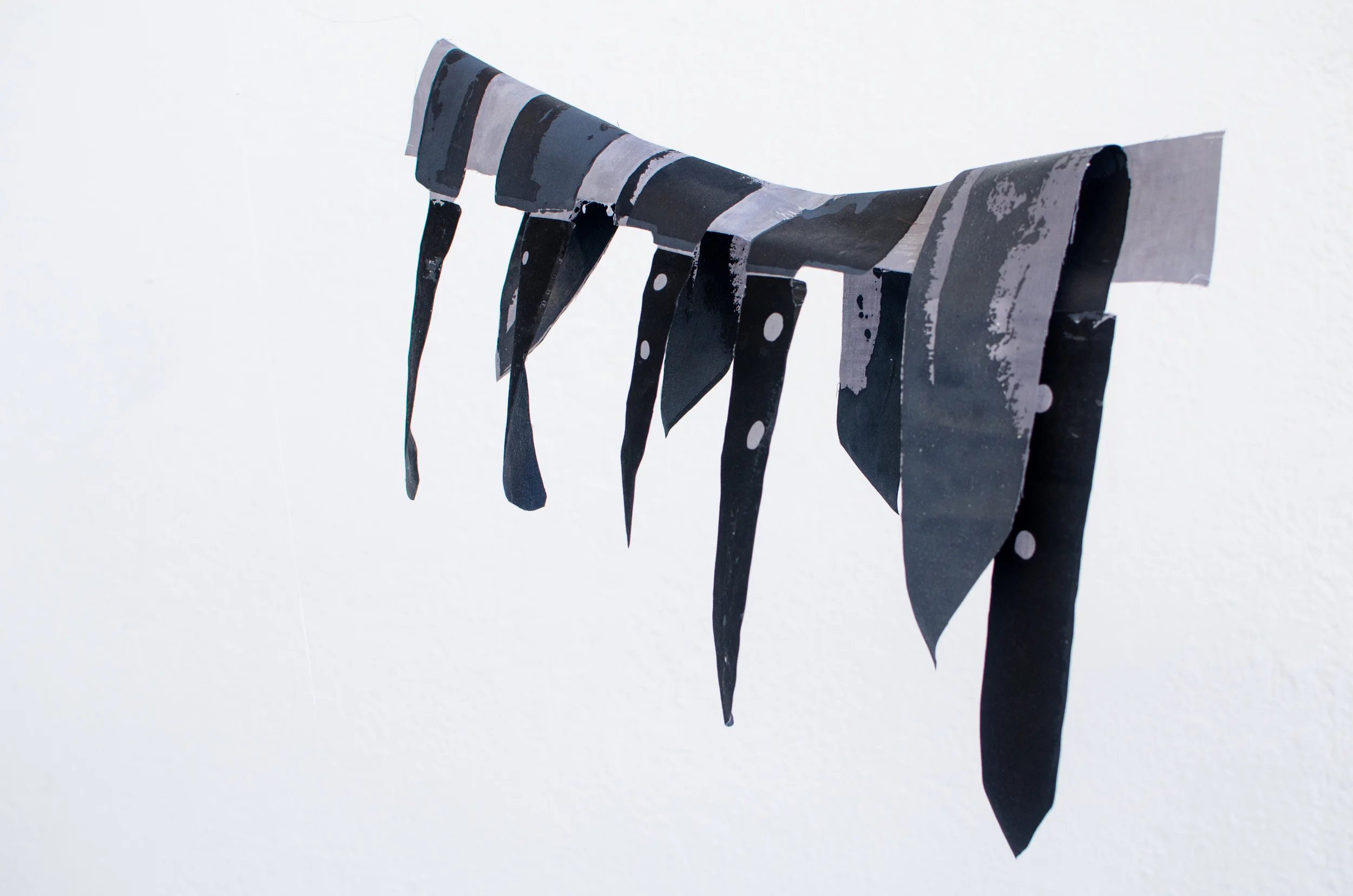 “(S)laughter” (detail), 2016, Screen-printed fabric, thread, plastic wrap, pvc pipe, monofilament