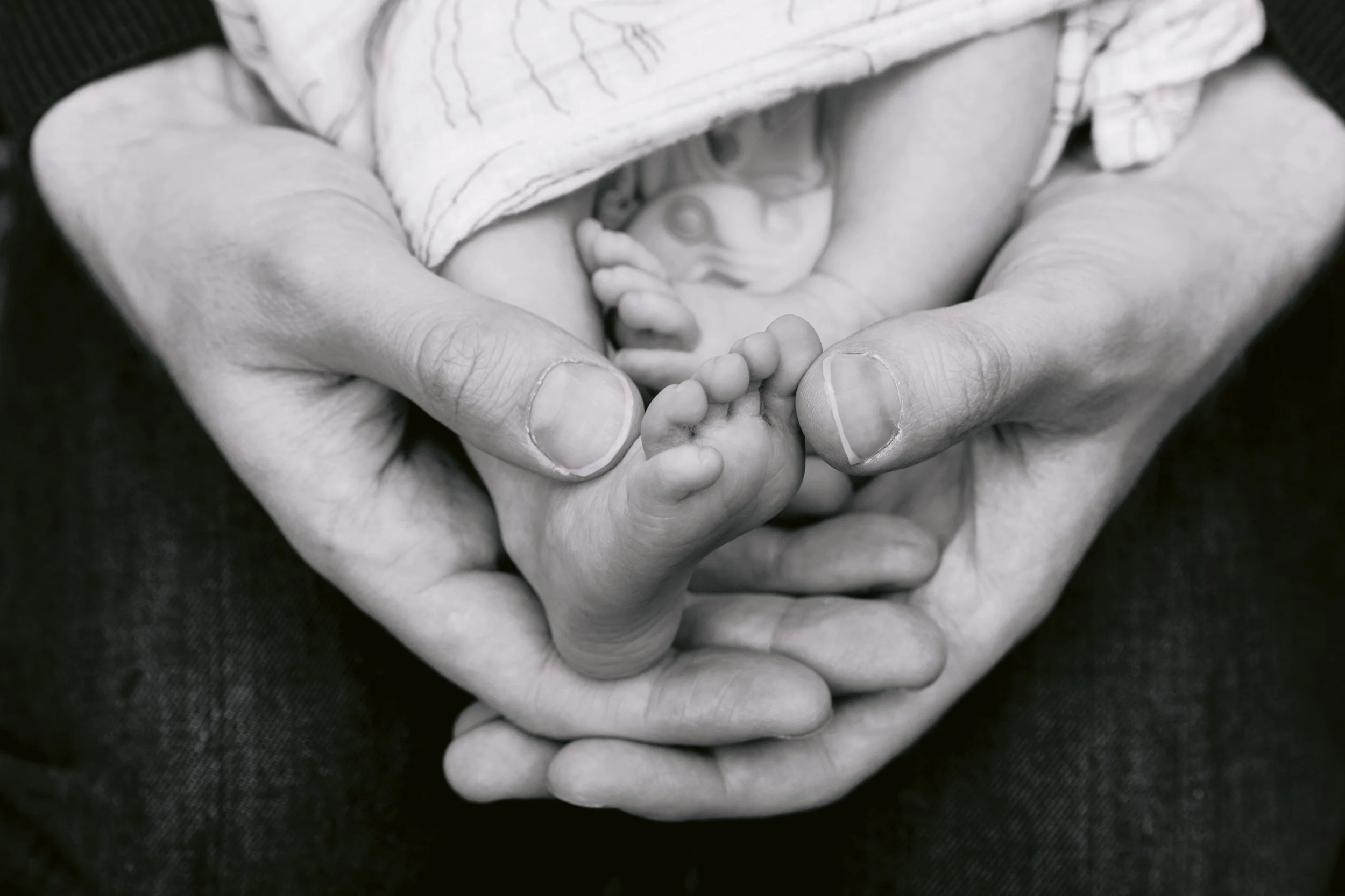 Detailed shot of baby's tiny feet during a newborn photography session in London
