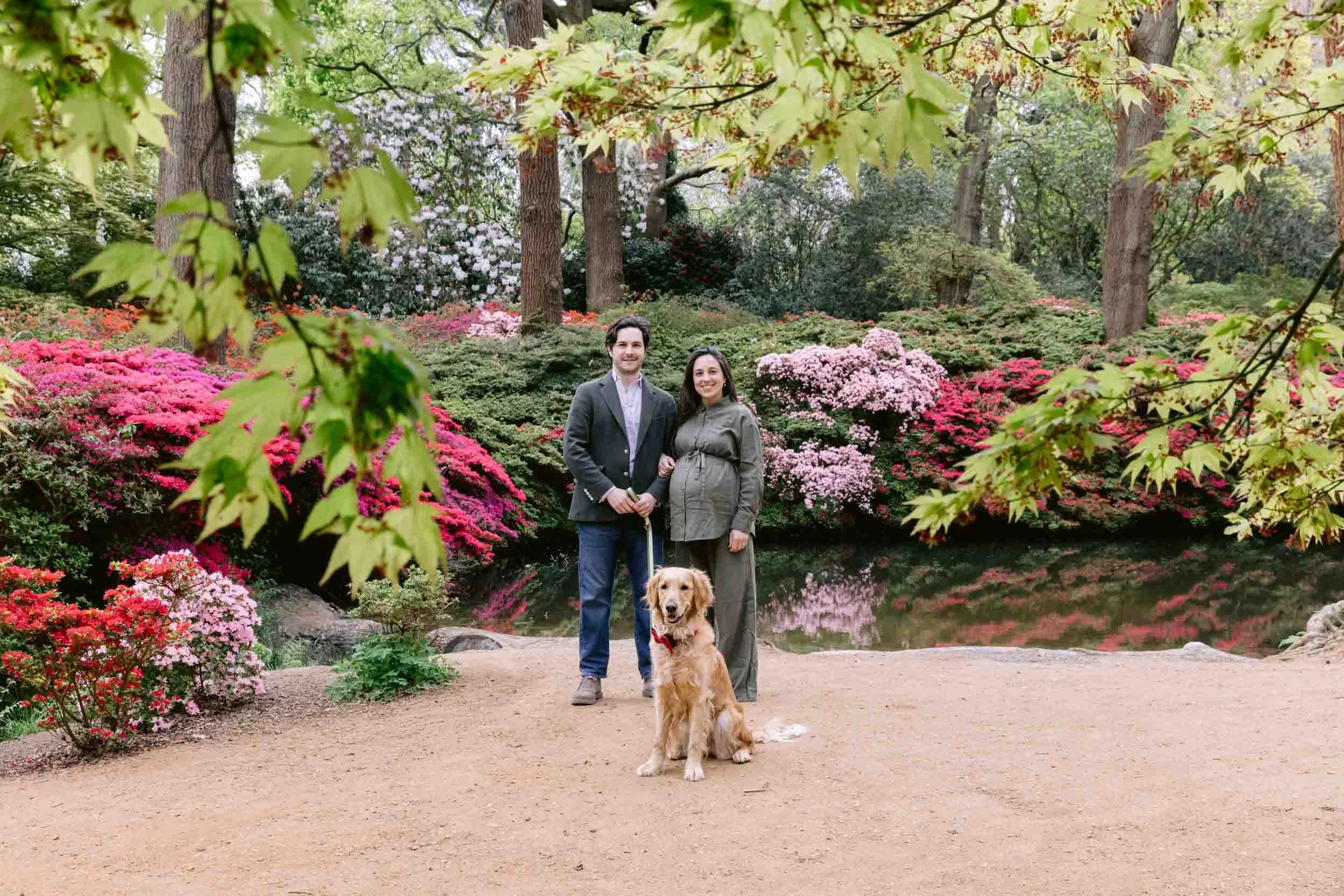 A couple stand in front of Still Pond in Isabella plantation during a maternity photoshoot