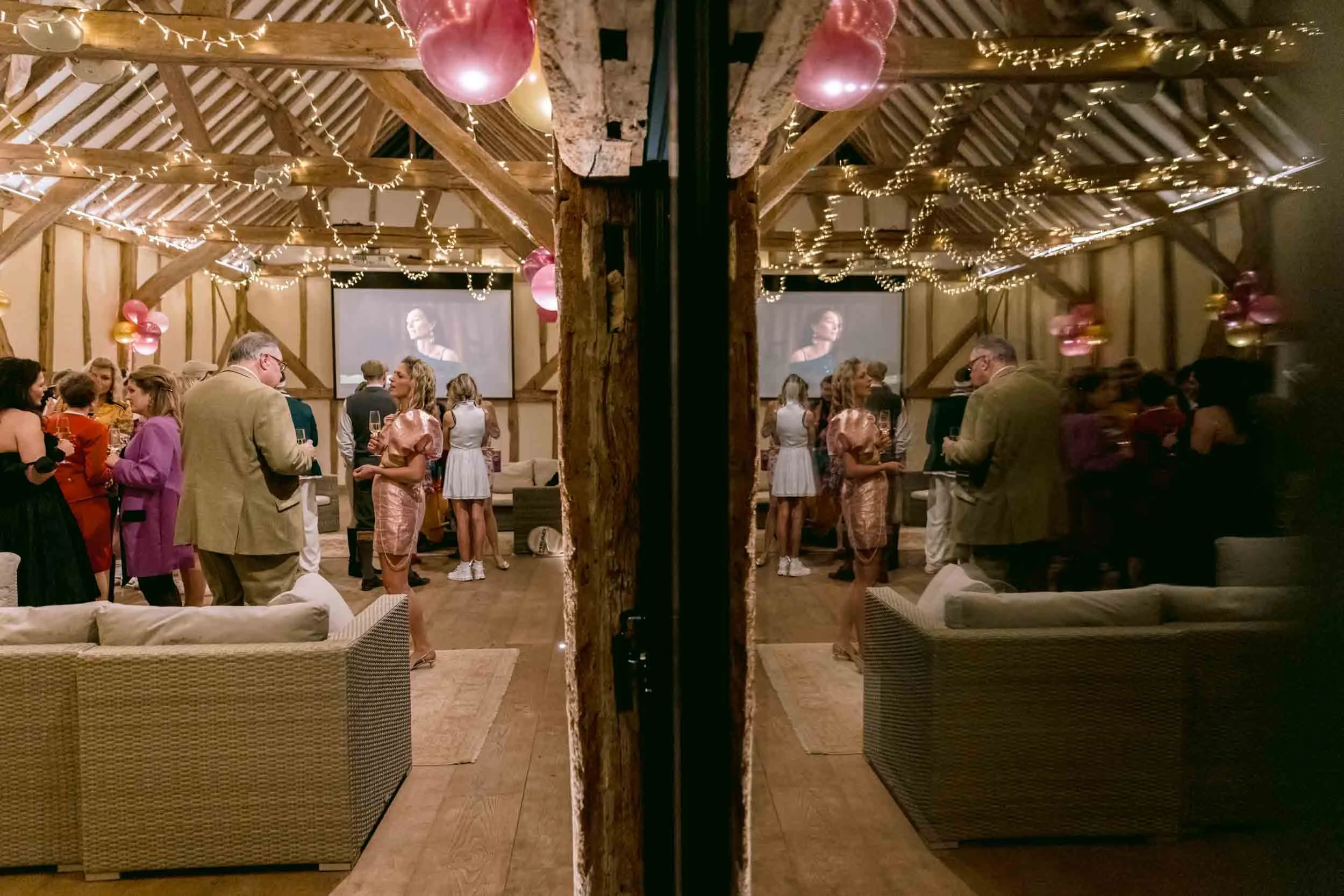 People chatting and mingling at a private event at Somersbury Barn in Surrey