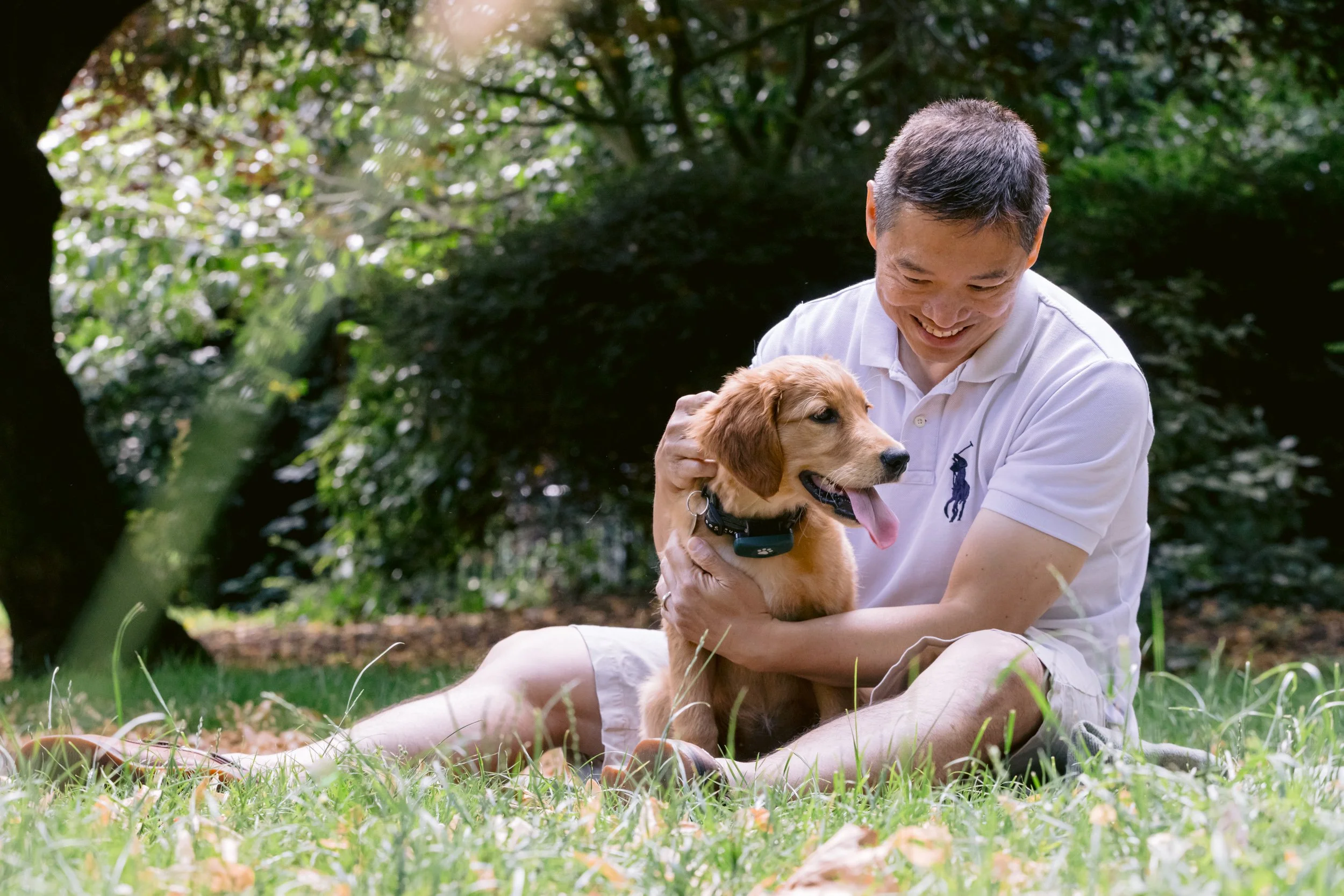 Owner and his owner whare a quiet moment in a private garden in London