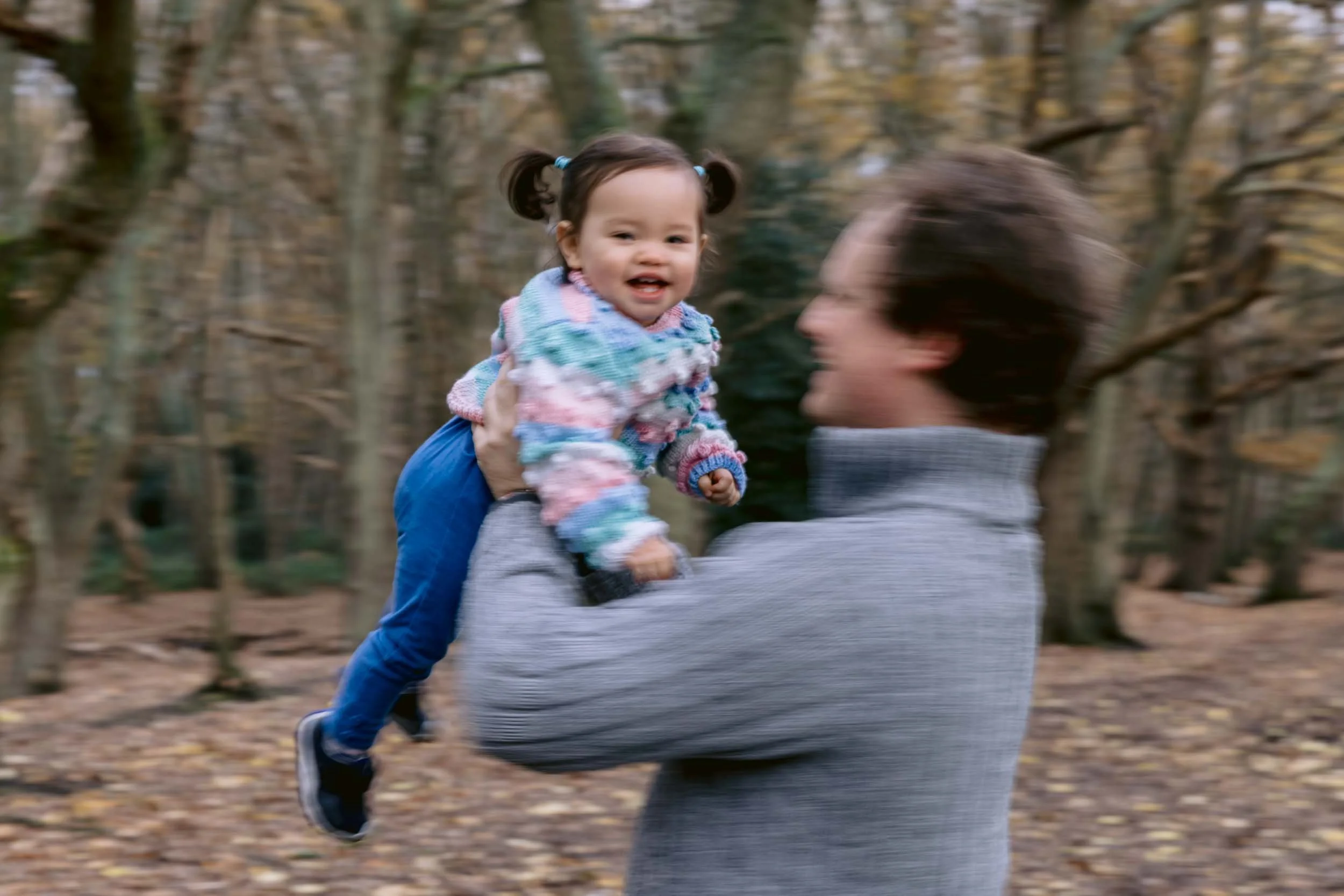 Family sharing a moment together in a London park in winter