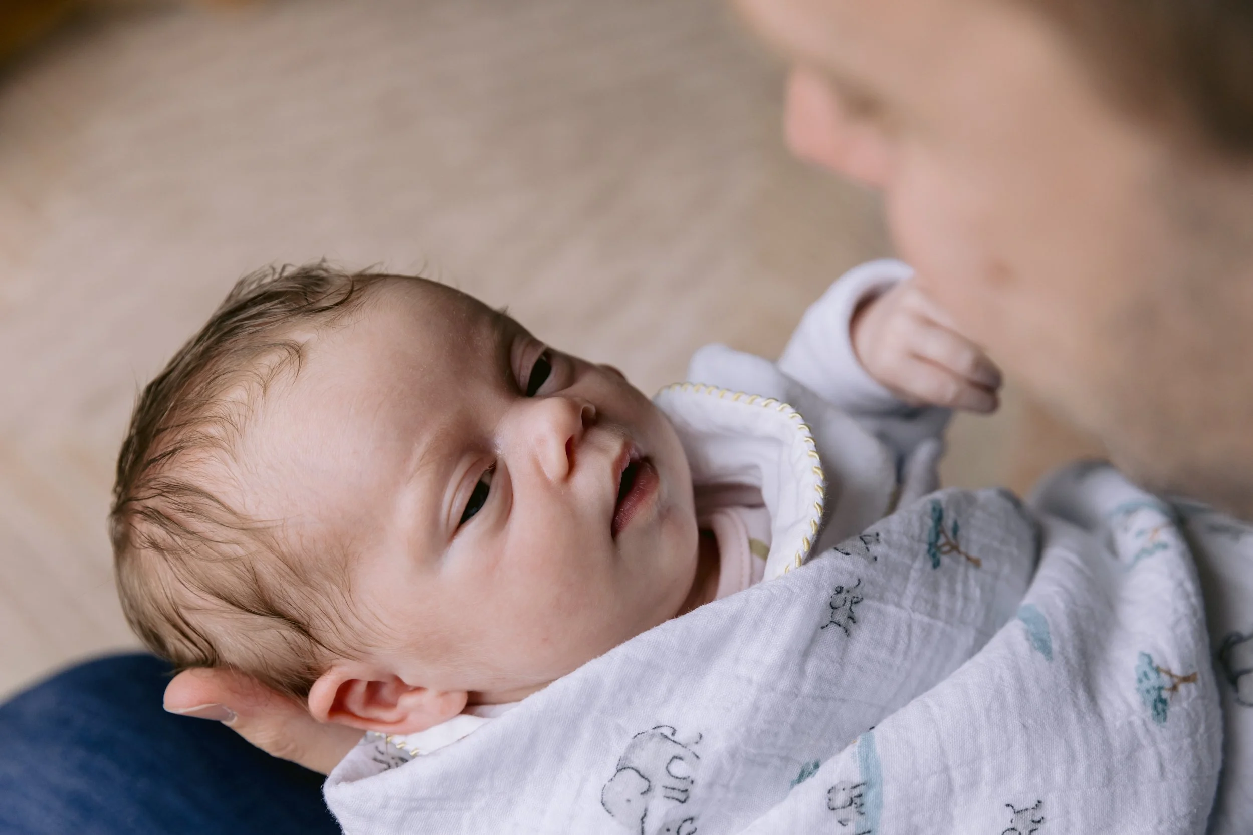 Baby looking at dad during a newborn photoshoot in South West London