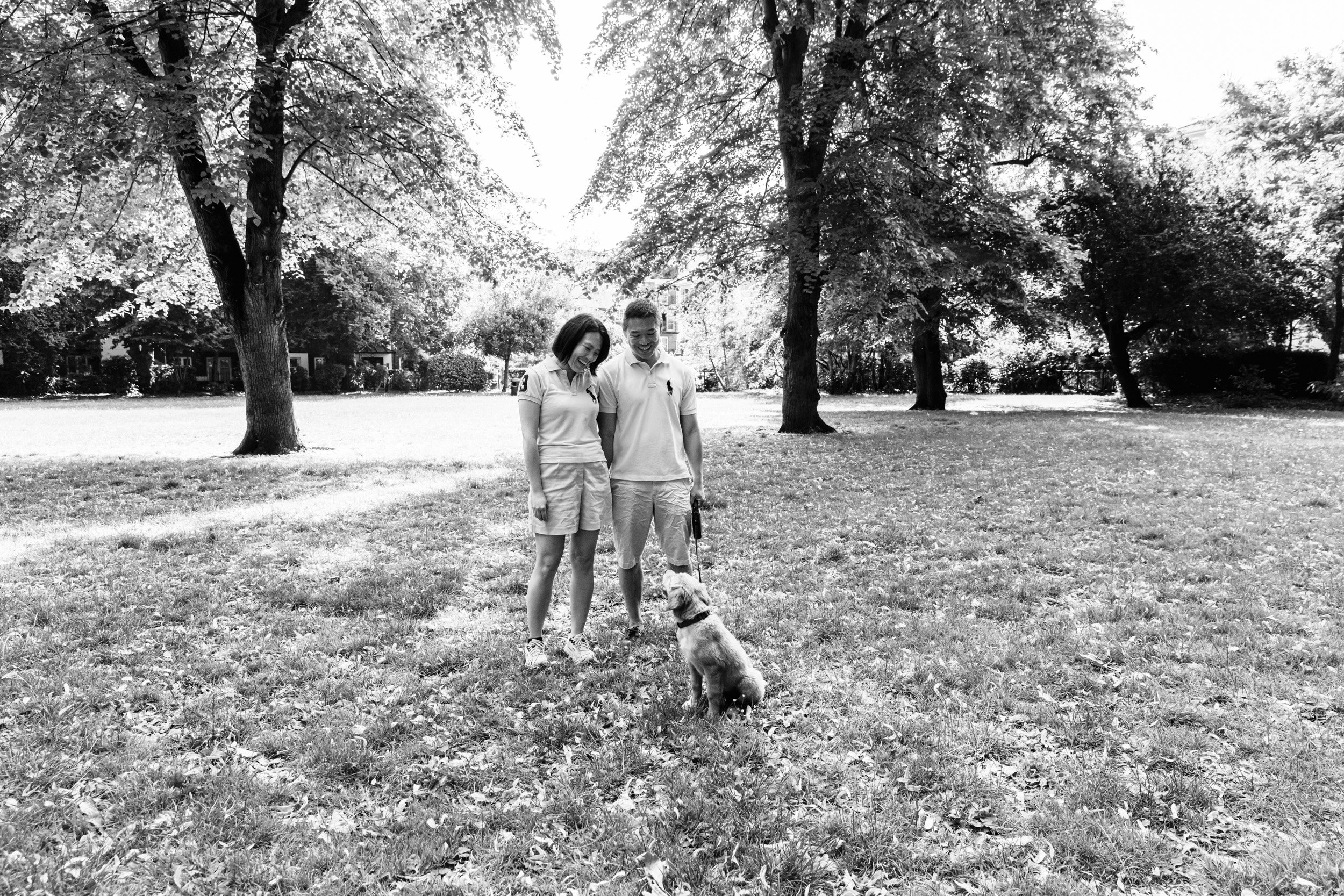 A couple looking at their puppy during a puppy & couple photoshoot in London