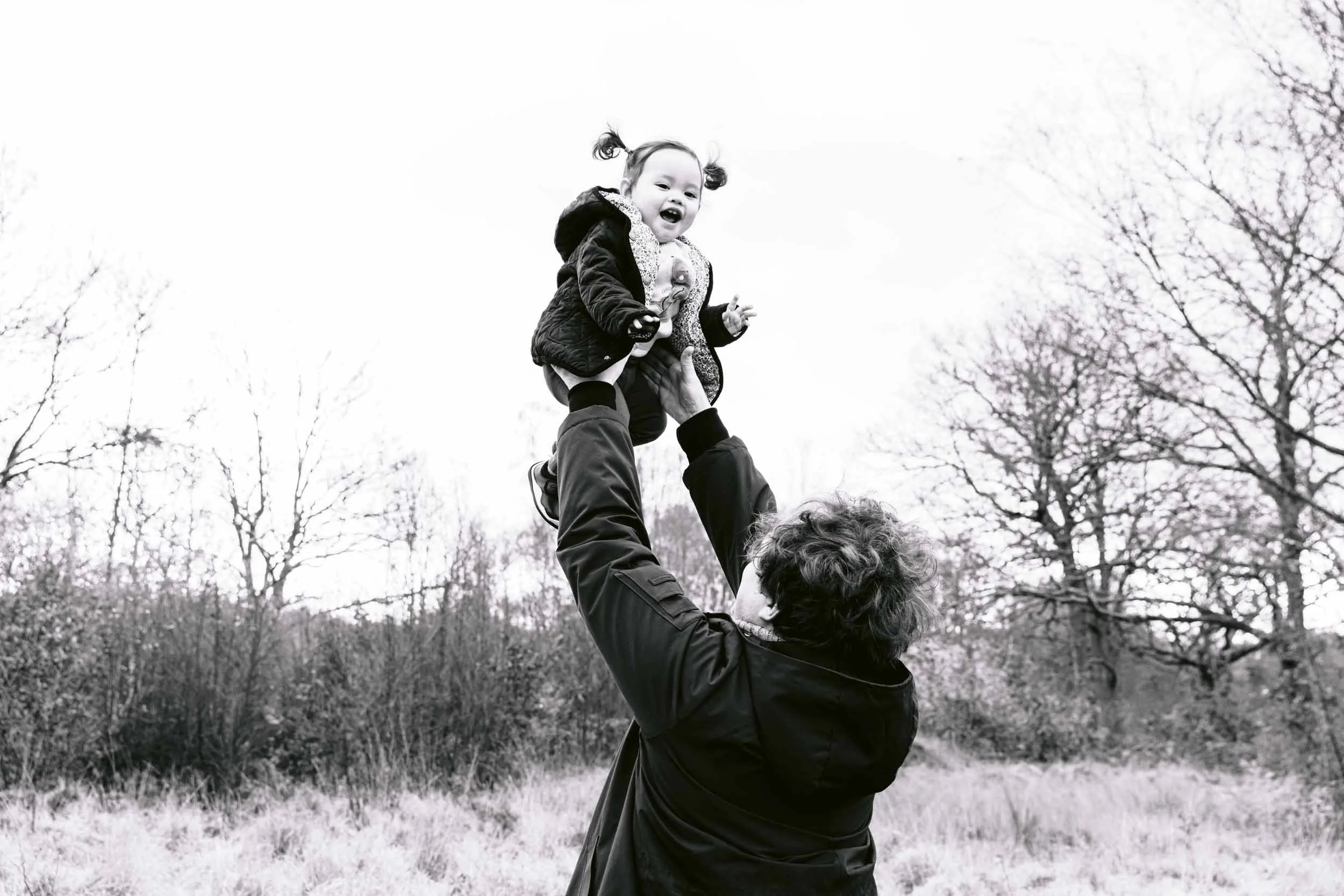 Family photoshoot taking place in a London park in winter