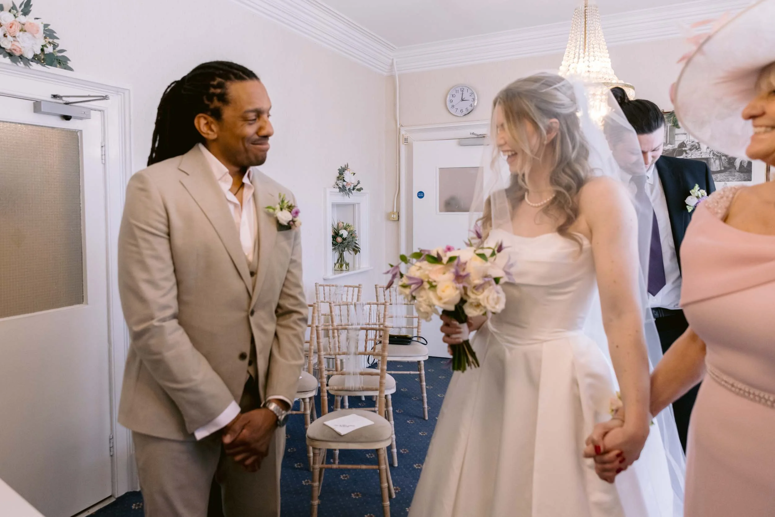 Bride and groom see each other for the first time at a small wedding ceremony at Artington House in Guildford