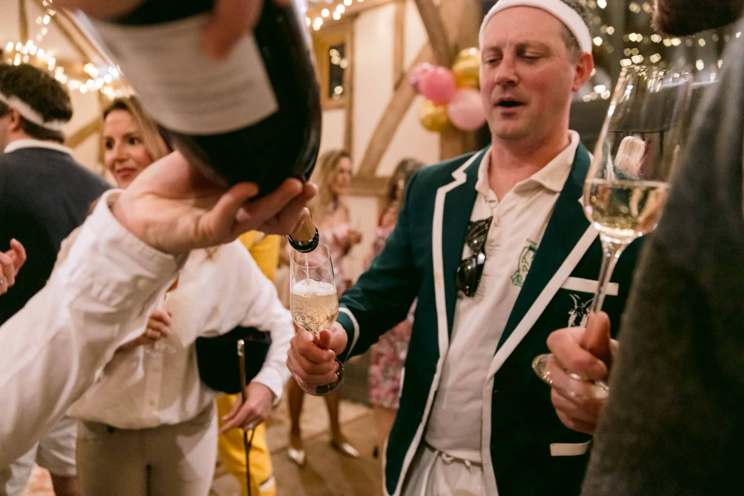 Drink being poured at a birthday party at Somersbury Barn in Ewhurst