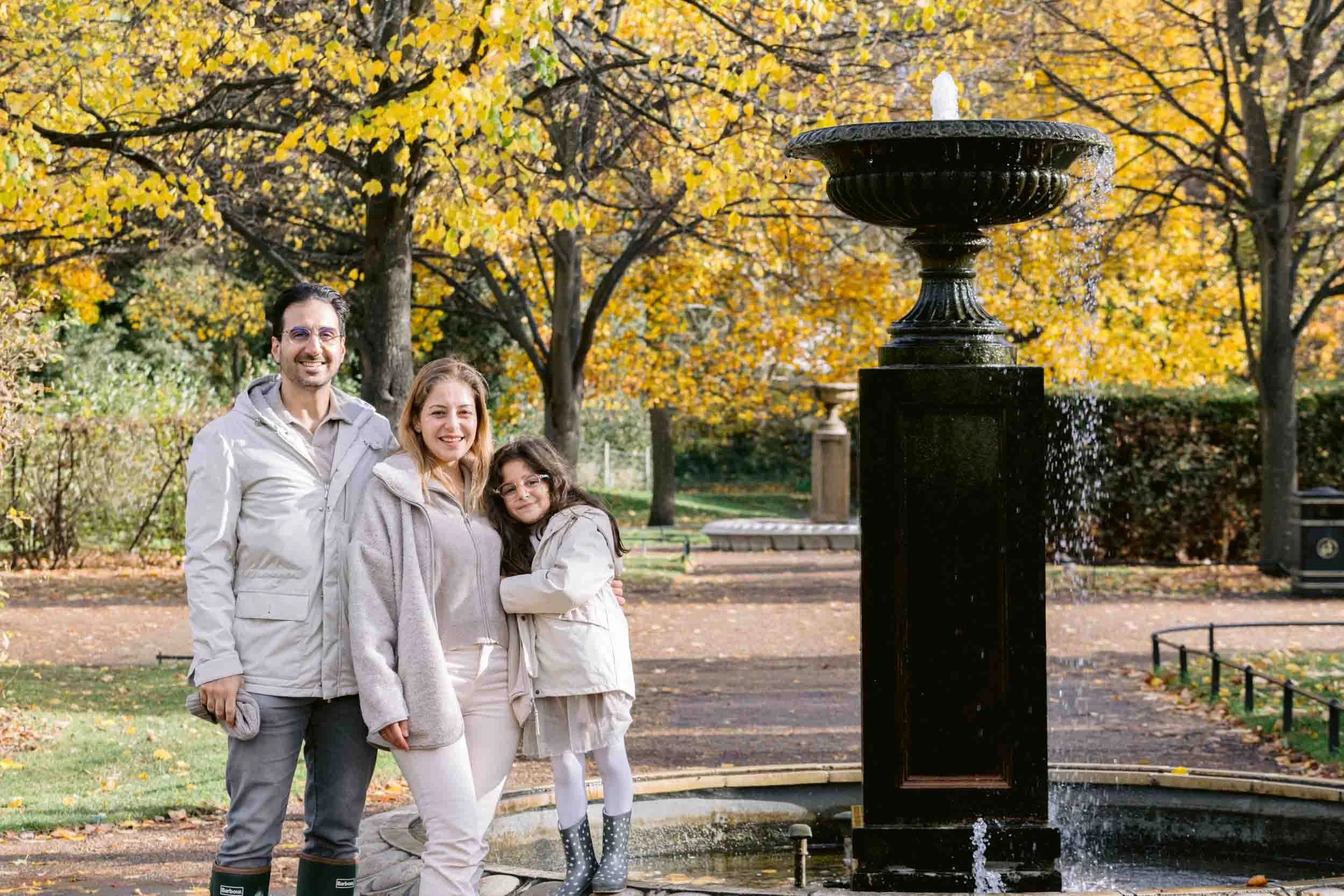 atural family portraits surrounded by autumn leaves in London