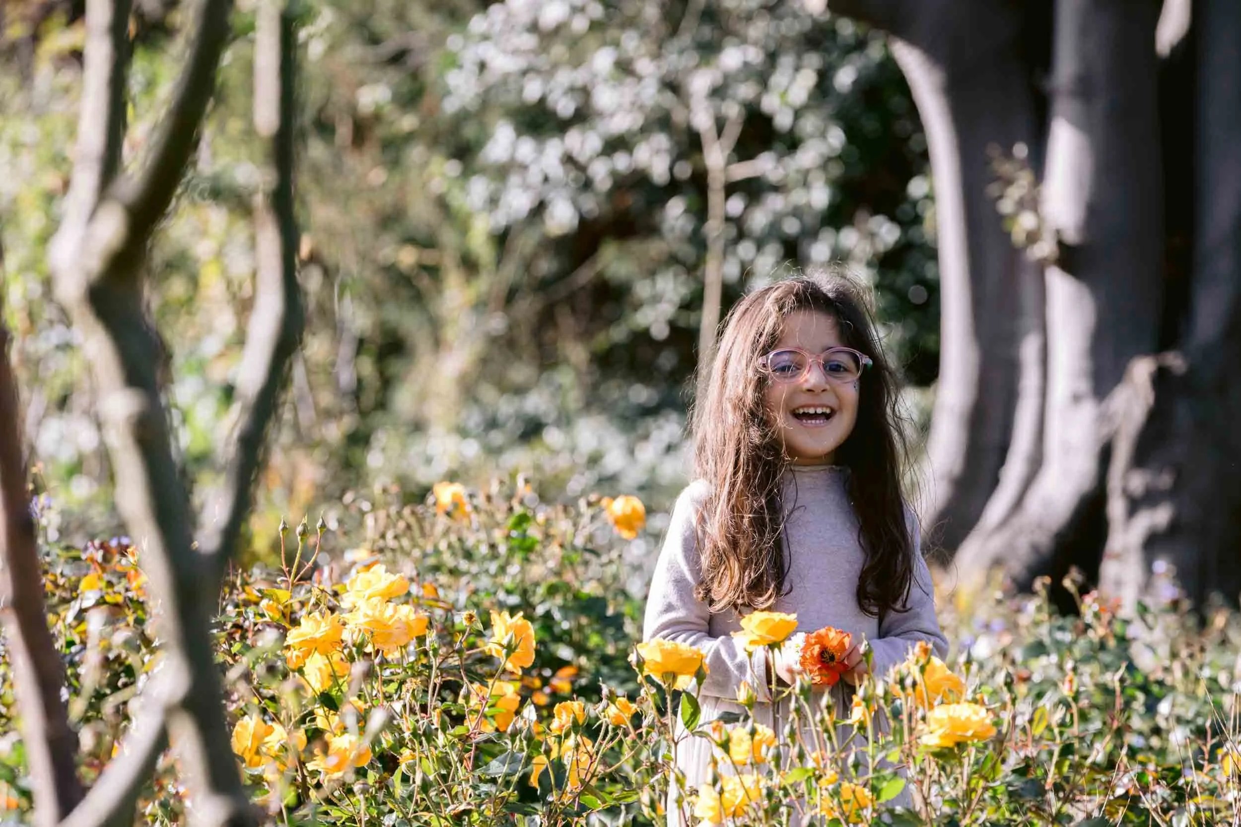 Child playing in the rose garden in Regent's park