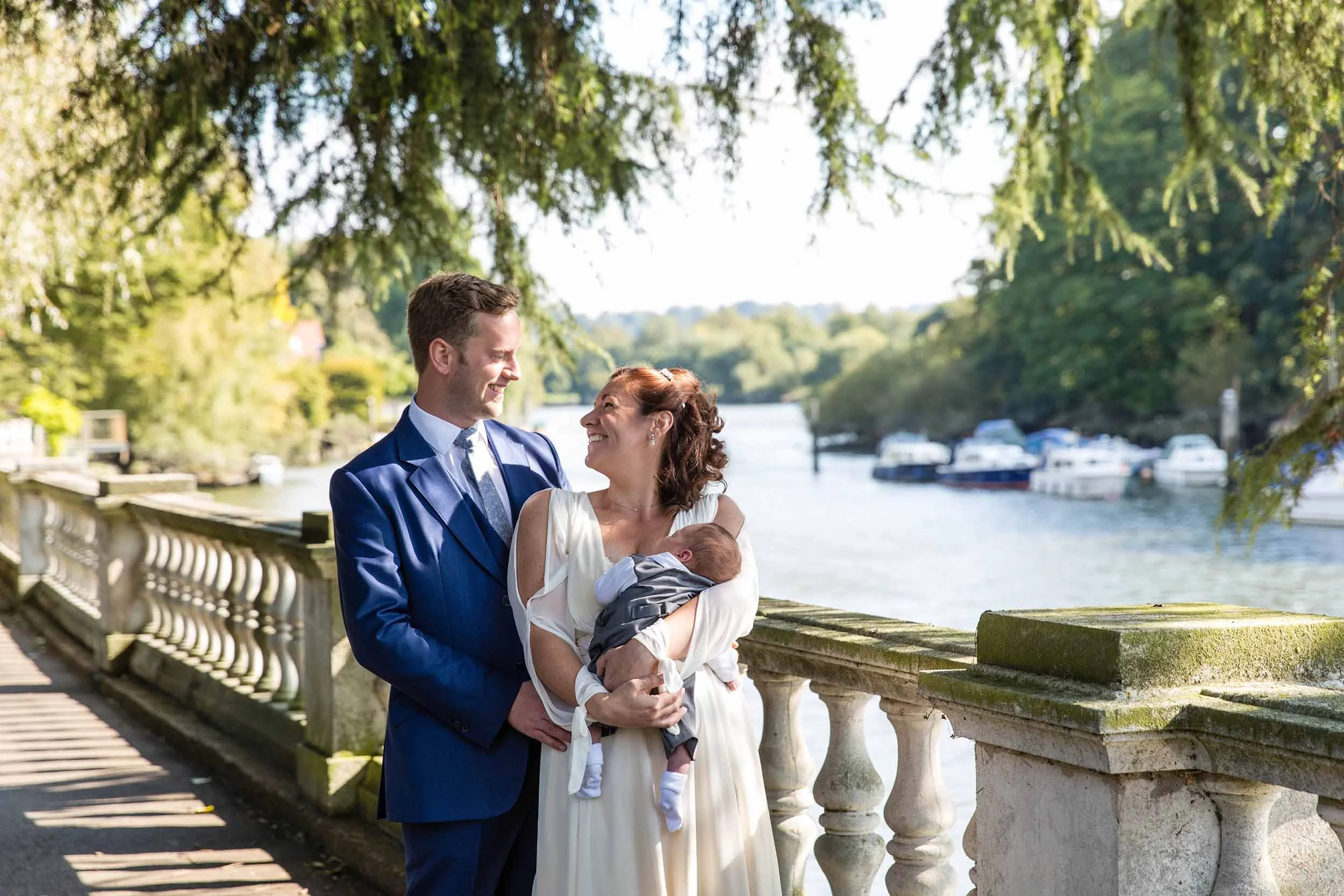 A couple enjoying a hug by the river after York House wedding ceremony