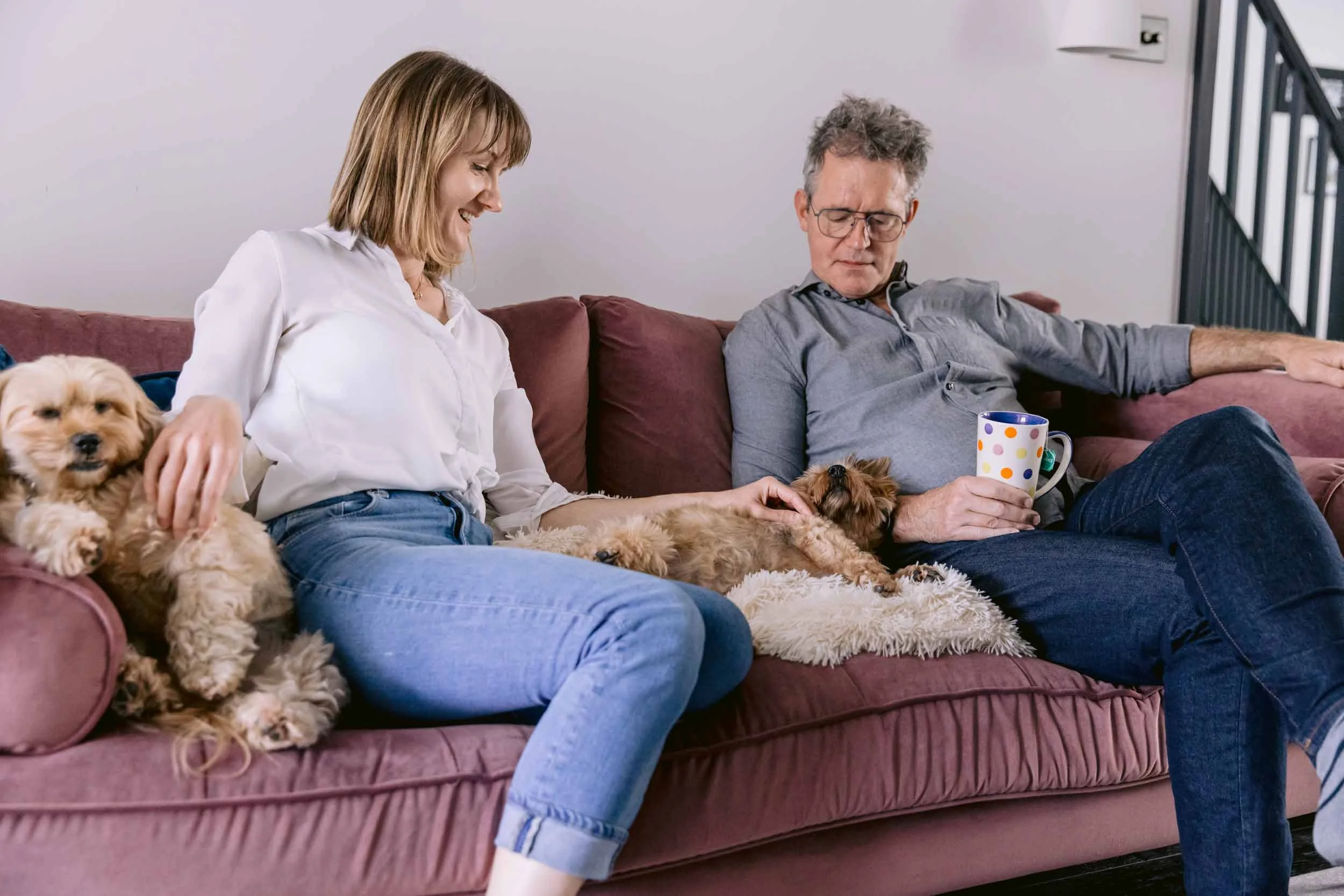 Couple enjoying a cup of tea with their dogs during a senior dog photography session in South London