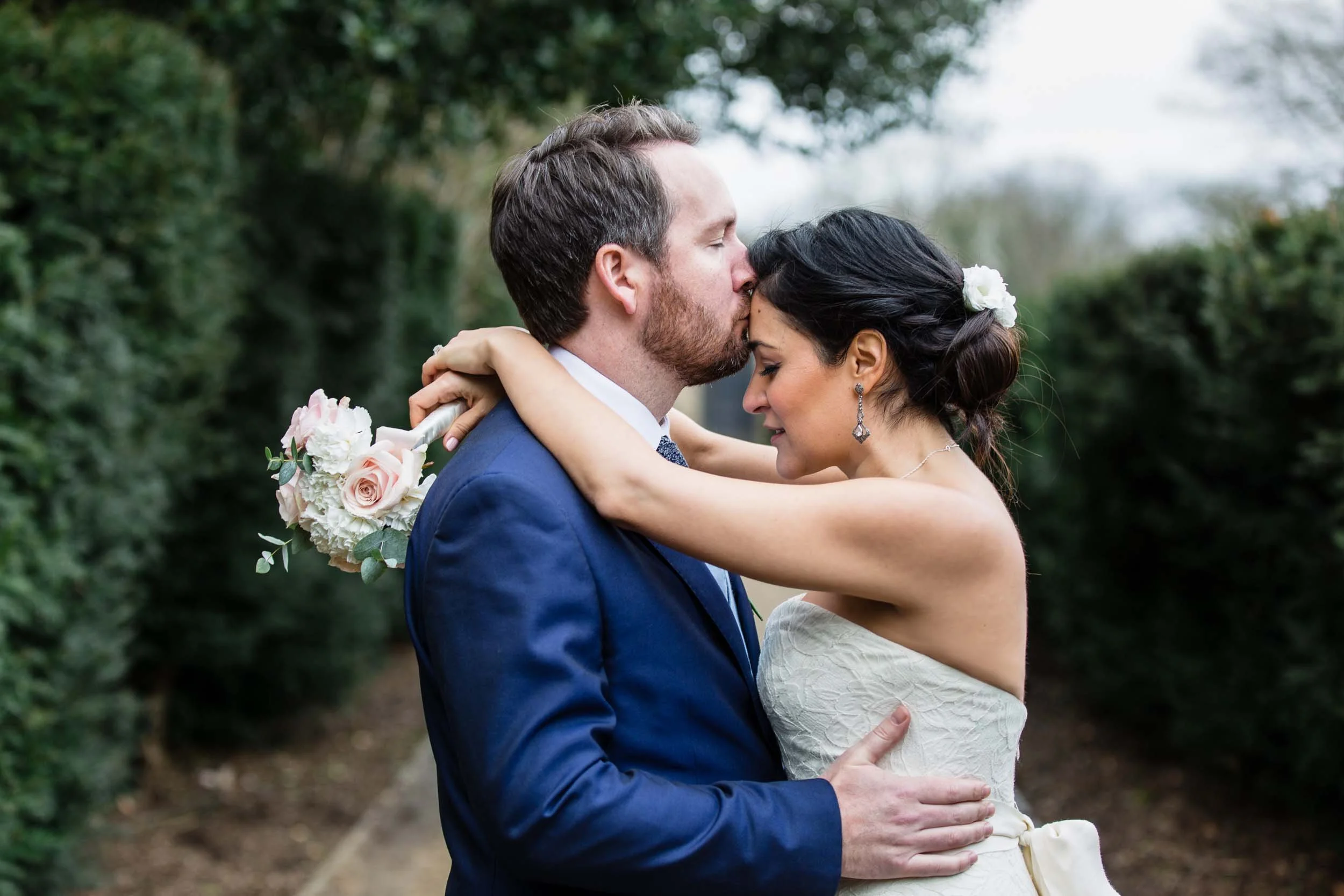Couple sharing a kiss following a wedding ceremony at York House in Twickenham