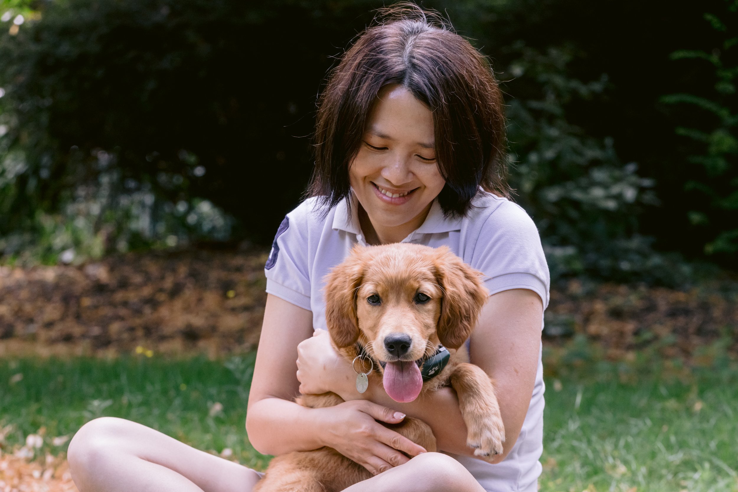 Owner and her puppy share a quiet moment during a puppy photoshoot in Surrey