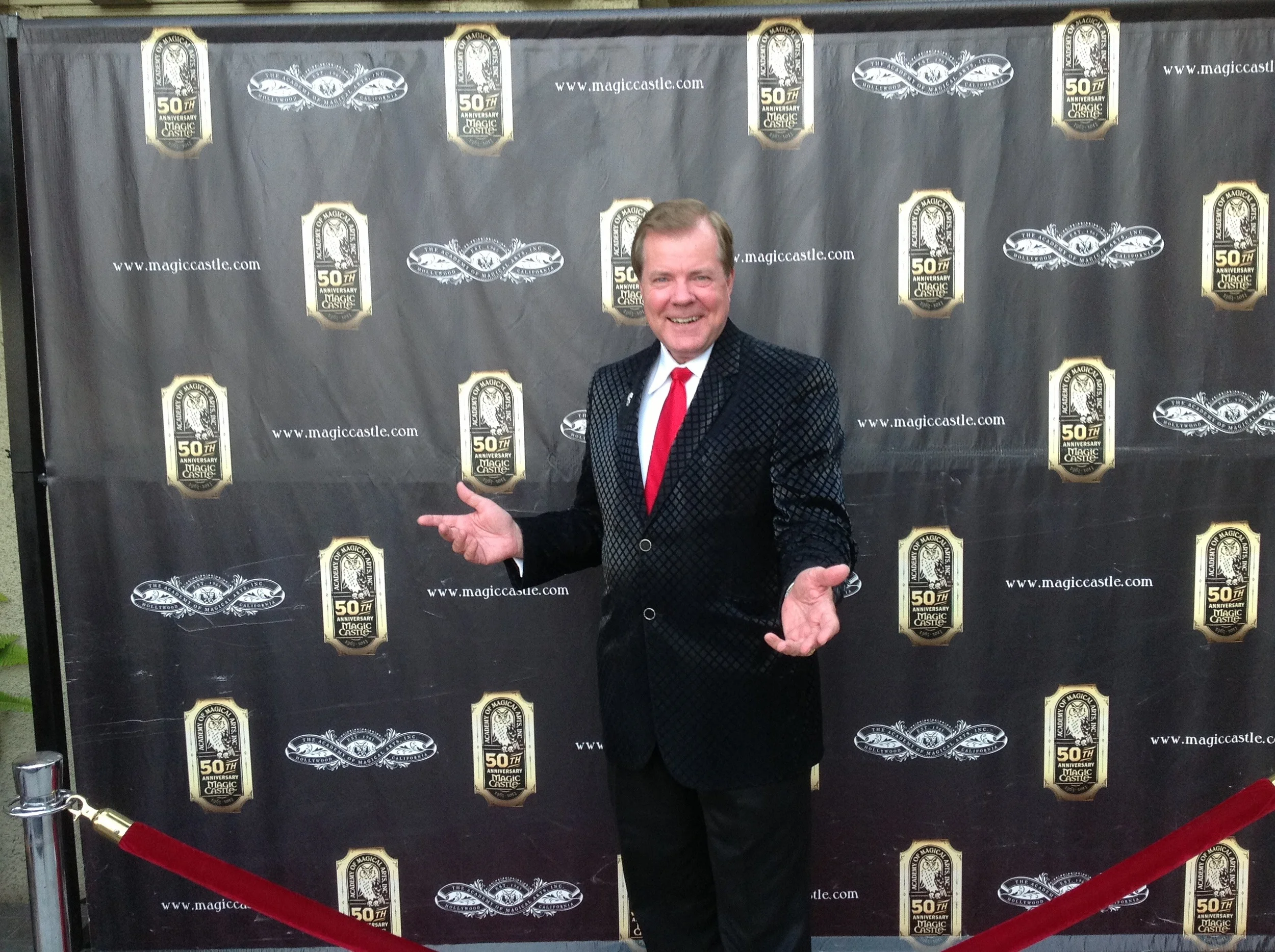 On the red carpet in front of the Magic Castle.