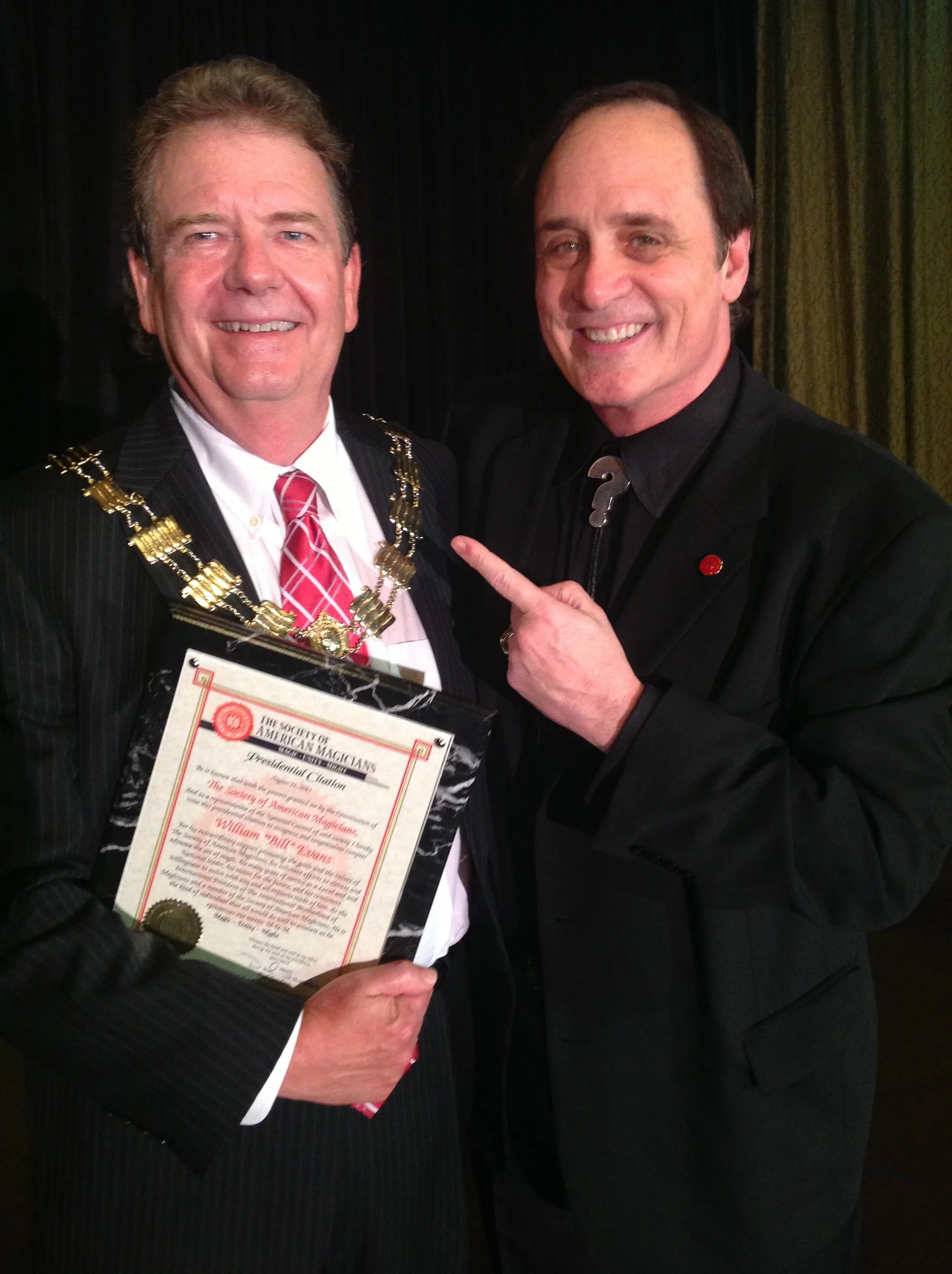 I.B.M. International President Bill Evans receiving certificate from S.A.M. International President Dal Sanders