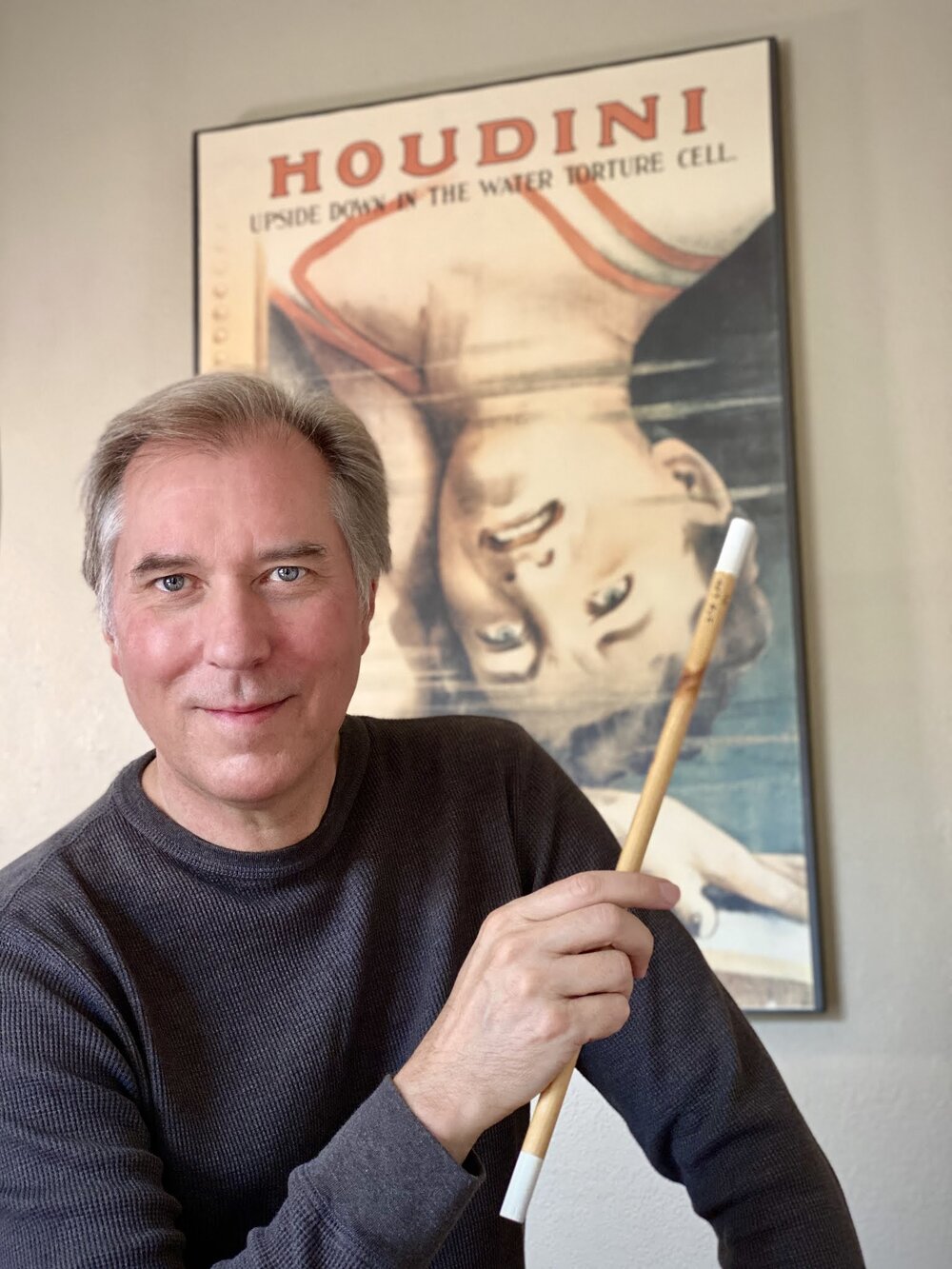 John Cox with wand made from wood from Houdini's home in New York