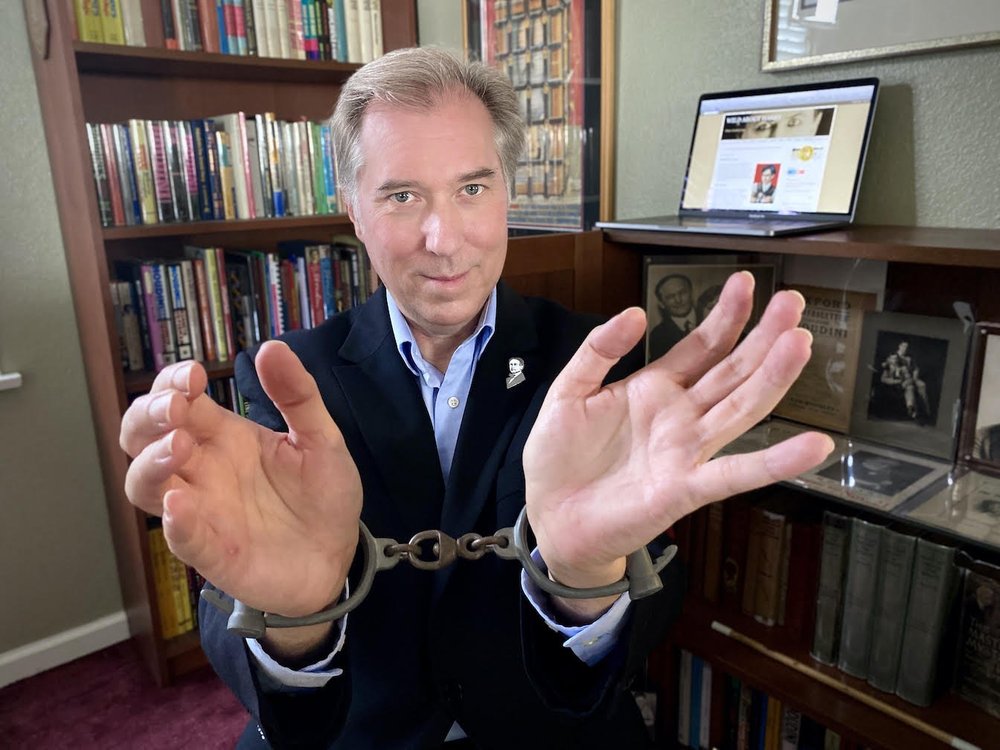 John handcuffed.jpeg