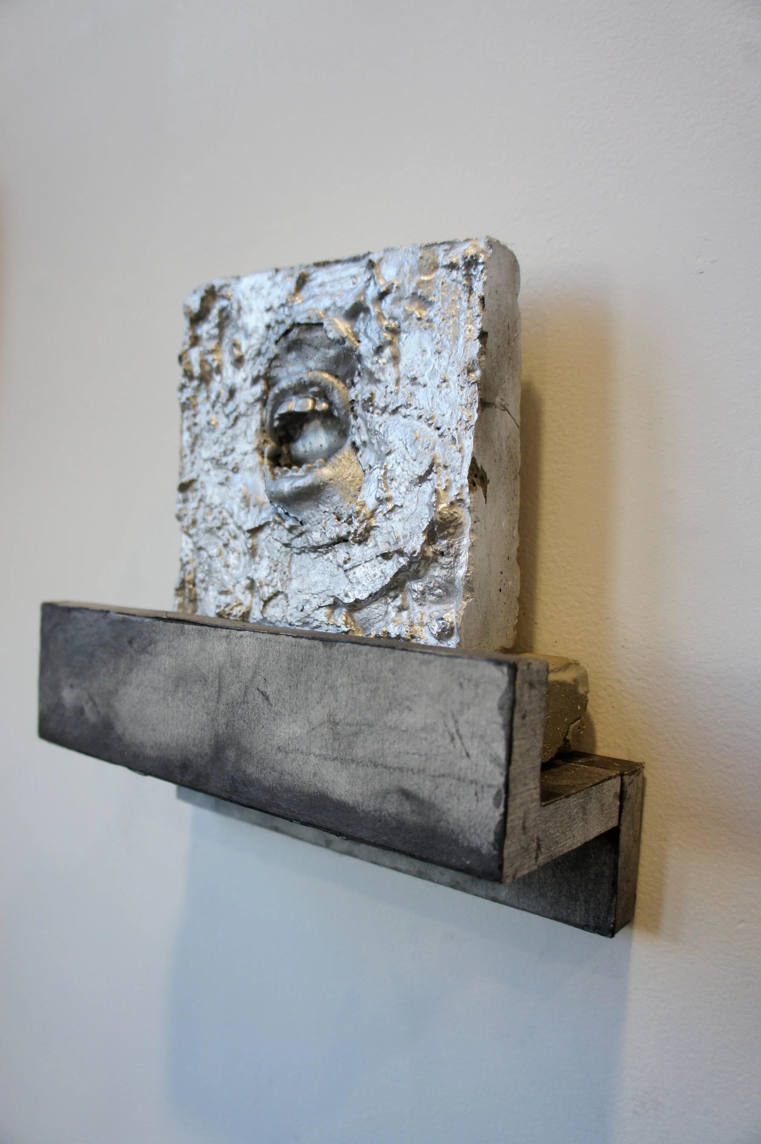Kill Your Idols , 2015. Cement, silicone, wood, graphite on paper. Approximately 8 x 8 x 3 in.