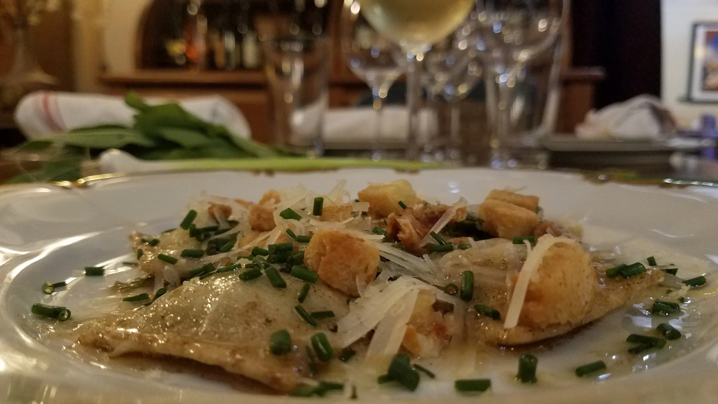 Fresh English Pea Ravioli appetizer in Brown Butter & Sage