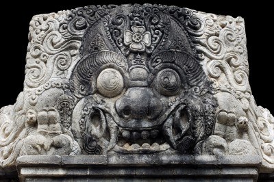 2592539-indonesia-bali-sculpture-of-kala--stone-sculpture-of-head-s-kala-traditionally-represented-in-the-to.jpg