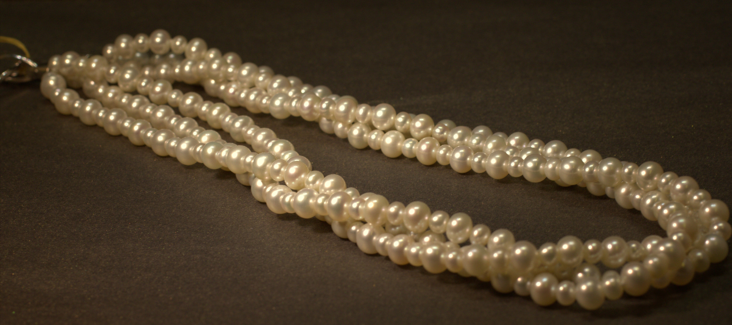 3 row alternating sizes pearl necklace with sterling silver clasp great color beatiful classic look for a great price lots of bang for your buck available at Marlen Jewelers in Rocky River minutes from Cleveland.jpg