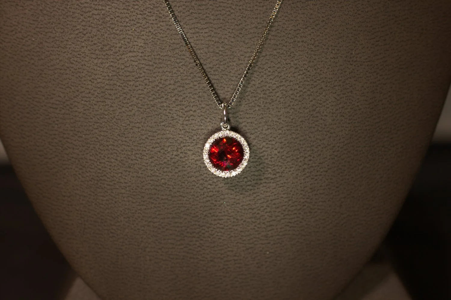 The garnet's fiery color resembles a pomegranate seed