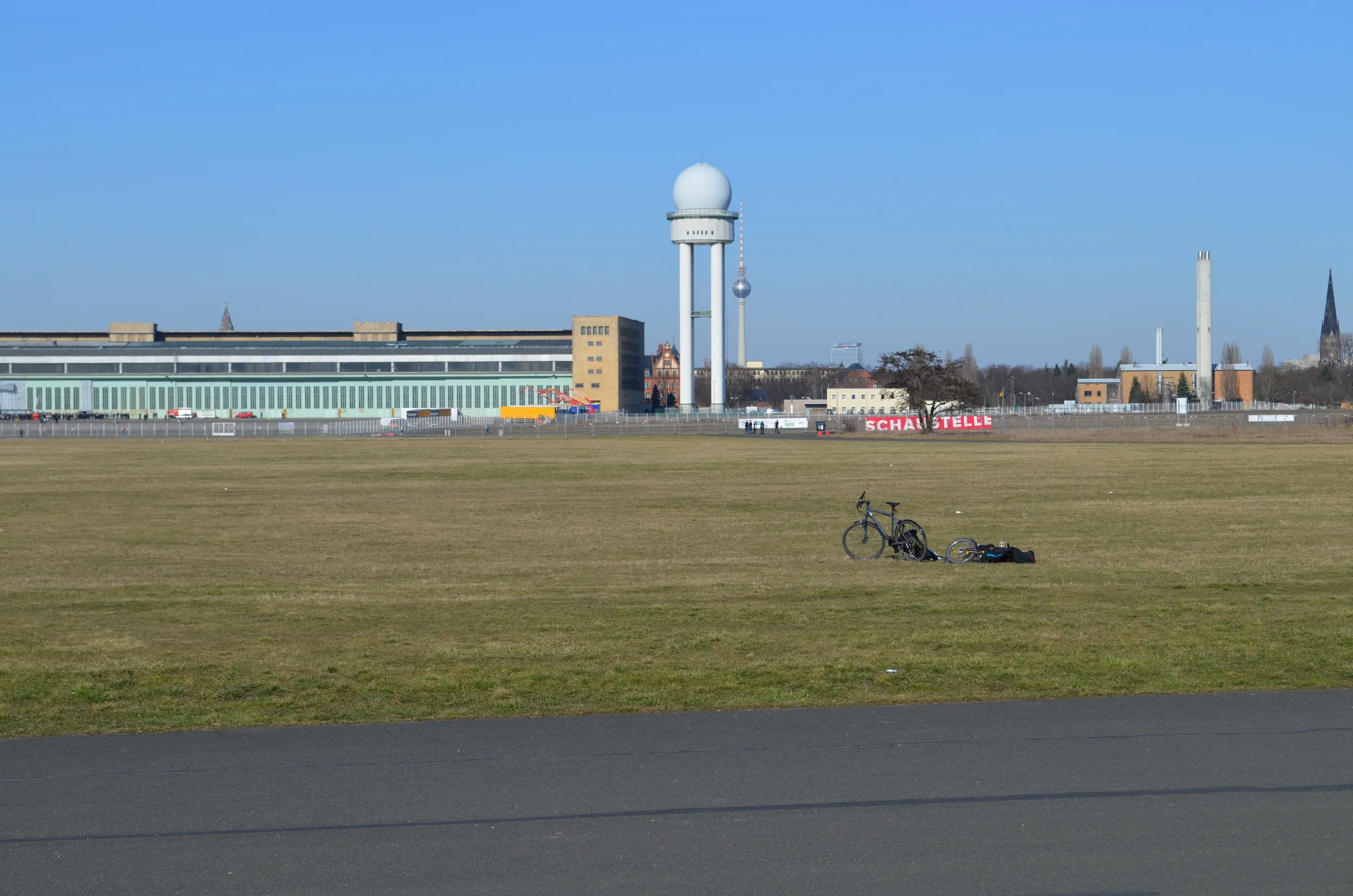 One edge of the main terminal building, with the radar tower on the right. Berlin's Fernsehturm is in the background.