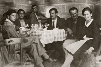 Harold Loeb (far left) and Hemingway (center with black tie)