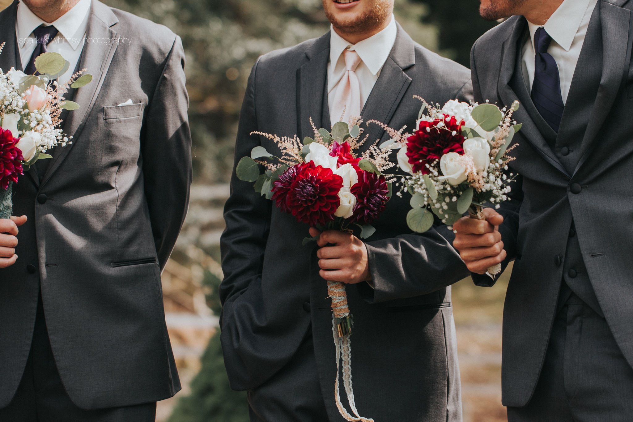 candid detail of groomsmen holding bouquets | Victoria BC Wedding Photographer