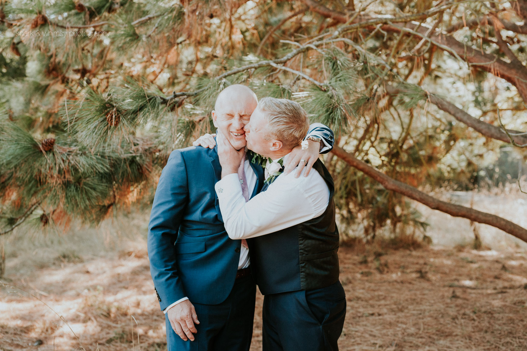 cheeky groomsmen kiss | wedding photographer victoria bc