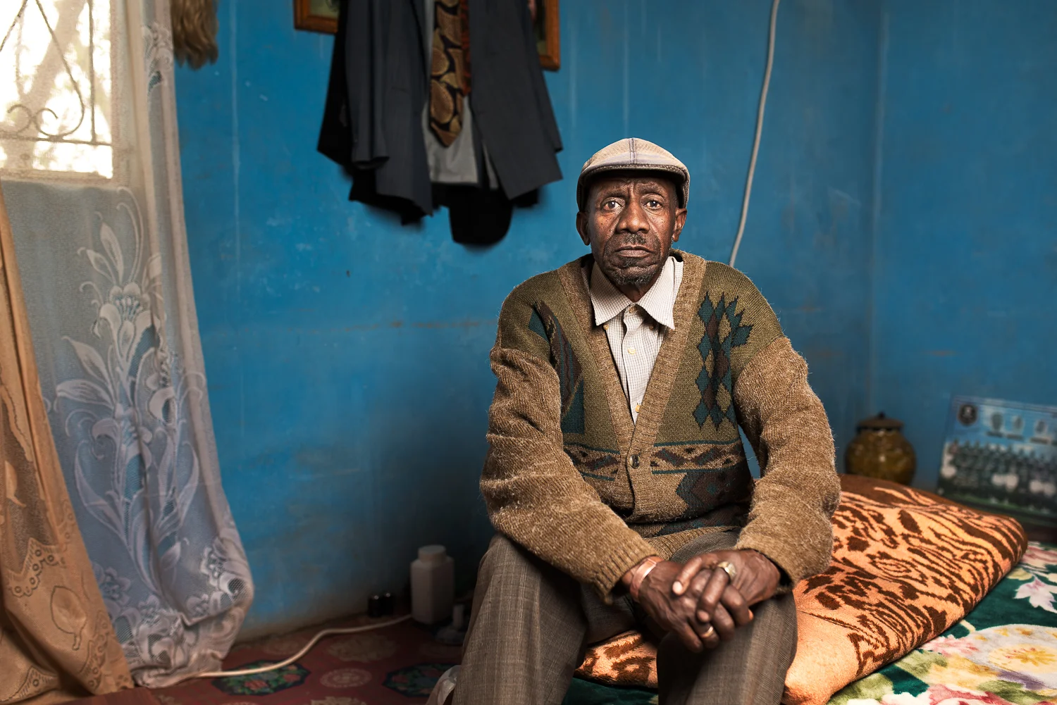 Motlalepula Mokoena , 71 years old from Maseru in Lesotho. He worked on the gold mines for 38 years as a loco driver and a team leader at Freestate Saaiplaas and Free State Geduld mines. He was retrenched in 2002 and paid R36,000 in compensation for his silicosis. He now receives an old age pension and lives alone as his wife has died and his 4 children have left home.