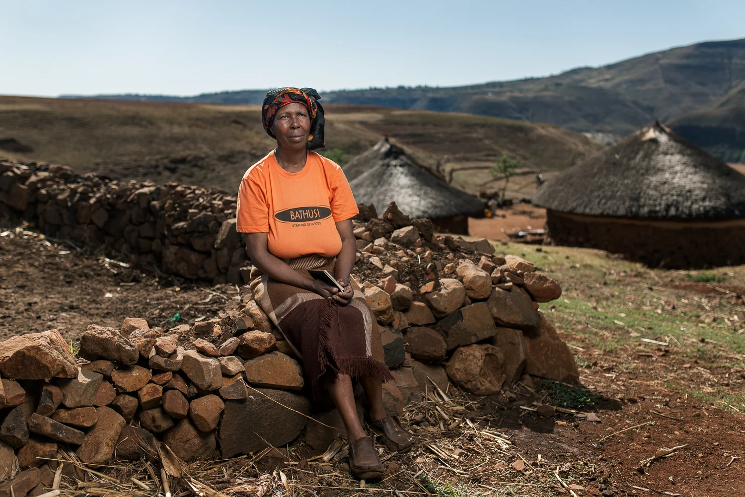 Mataso Makone, the Widow of Molupe Makone, is 51 years old and lives in Butha Buthe, Lesotho. Her husband worked on the mines for 33 years, between 1974 and 2007 and died from tuberculosis in 2011. He was retrenched due to his medical condition but never received any compensation. Now she has to survive with money she receives from her daughters who are domestic workers in South Africa. Speaking about why she married a miner she said that they met when she was 16, he sent a friend to tell her that he was interested. “I liked him a lot also,” she said. “Since he was already working I felt safe with him because I knew he was going to provide”.