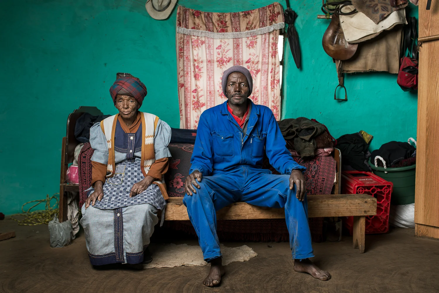 Xolisile Butu is 60 years old and lives in Skhobeni in the Eastern Cape with his 86 year old mother Adelaide. His wife works in Komani and earns the money for the household - she only comes home once a month. Mr Butu was diagnosed with pulmonary tuberculosis (TB of the lungs) in 1992 after working on the mines for 7 years. He received R1000 (approx. £50 or $72) in compensation. Mr Butu recalls what he calls “the problems between Xhosas and Zulus” on the mines. The fights got so bad that the police would be called and would break them up using teargas. After a while they started to live in separate dorm rooms. 
