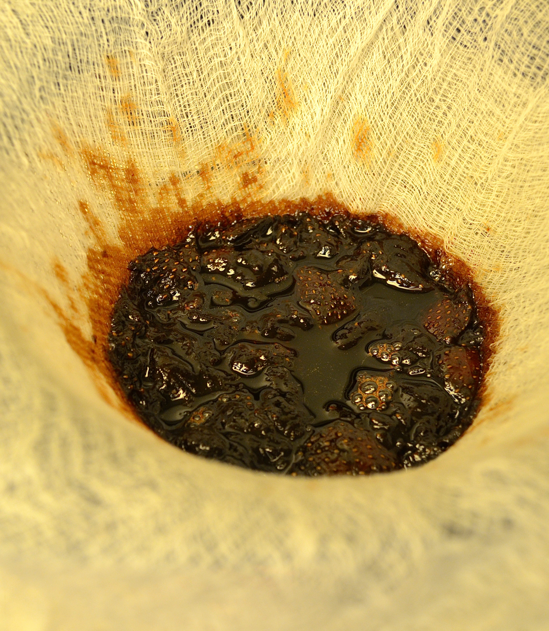 Straining the strawberry-balsamic gastrique