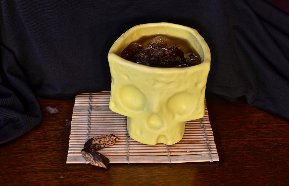 Bombo in a Vantiki skull sippy cup.