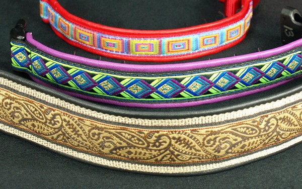 These are the same three collars showing more of how they would look when on the dog. In most circumstances, you cannot see the prongs on the 1 1/2 inch collar at all. The prongs are slightly visible on the (purple) 1 inch leather lined collar and more so on the (red) 3/4 inch leather lined collar. (The prongs are a little difficult to see in this photo because of the way the light is reflecting on them so look carefully.)