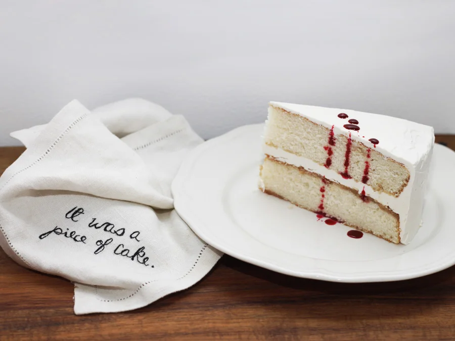    It Was a Piece of Cake   Embroidery on vintage linen napkin. White cake with vanilla Swiss Meringue Buttercream and mock blood drops. 