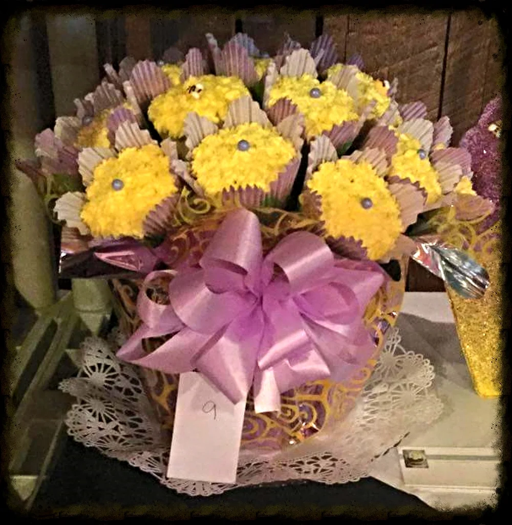 Kim won FAN FAVORITE at the Wooden Nickel cupcake wars in Silverton, OR with her colorful, tasty, and tempting lavender and yellow cupcake bouquet using The Cupcake Rack! Thank you Kim for sharing your beautiful display. It's almost as lovely as YOU! (Kim is an amazing woman!)