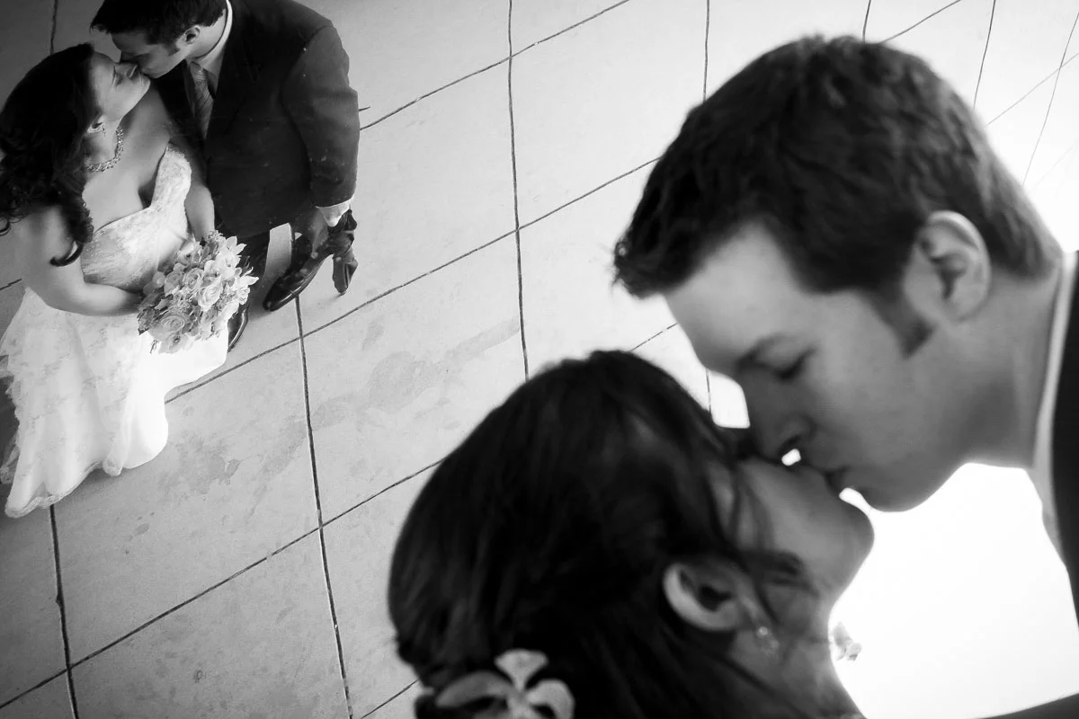 Bride & groom are reflected underneath the Bean at Millennium Park Chicago.